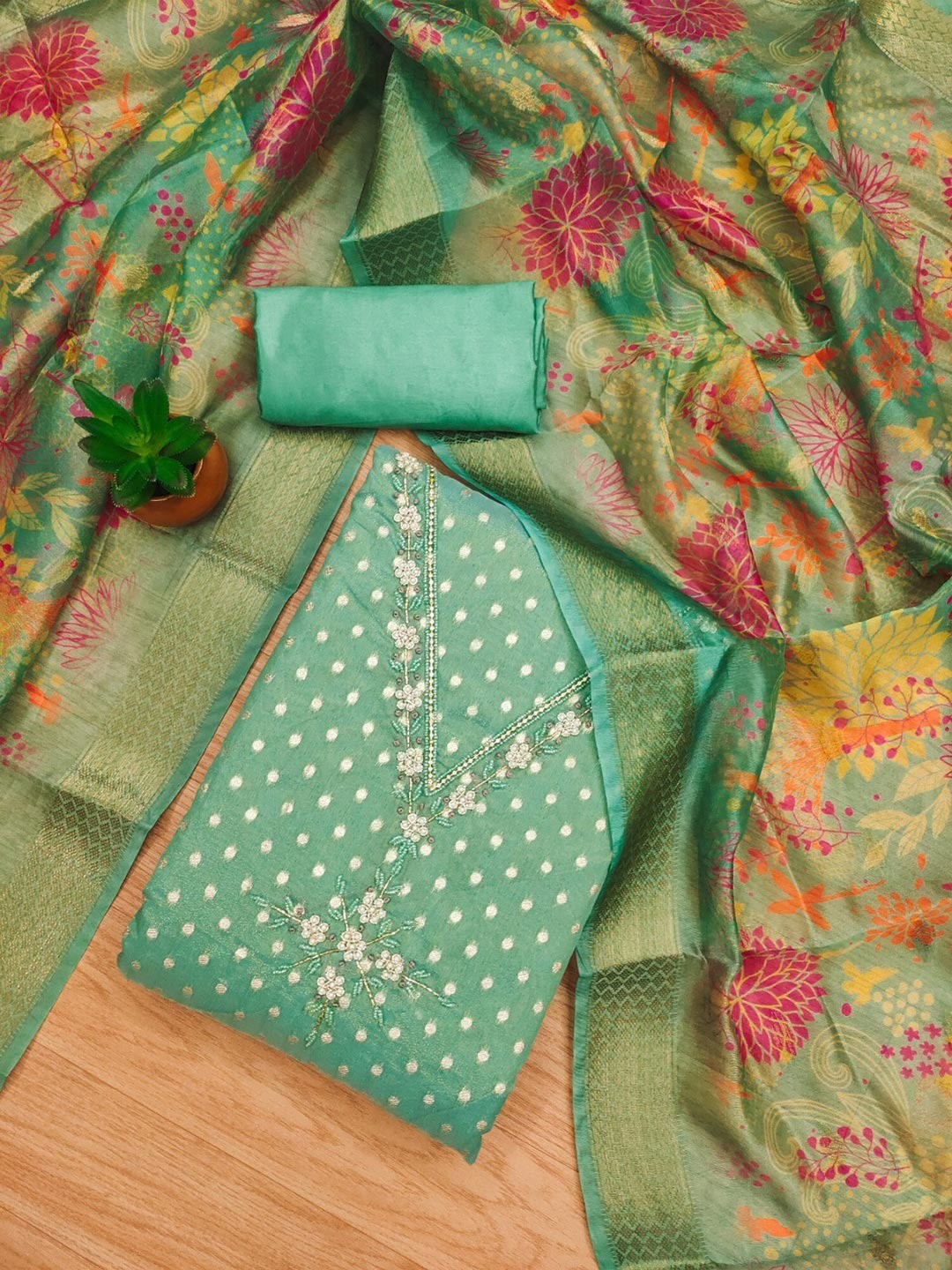Luxury Turquoise Woven Shimmer Dress Material Featuring Exquisite Moti Beads & Stone Embellishment - Image 1