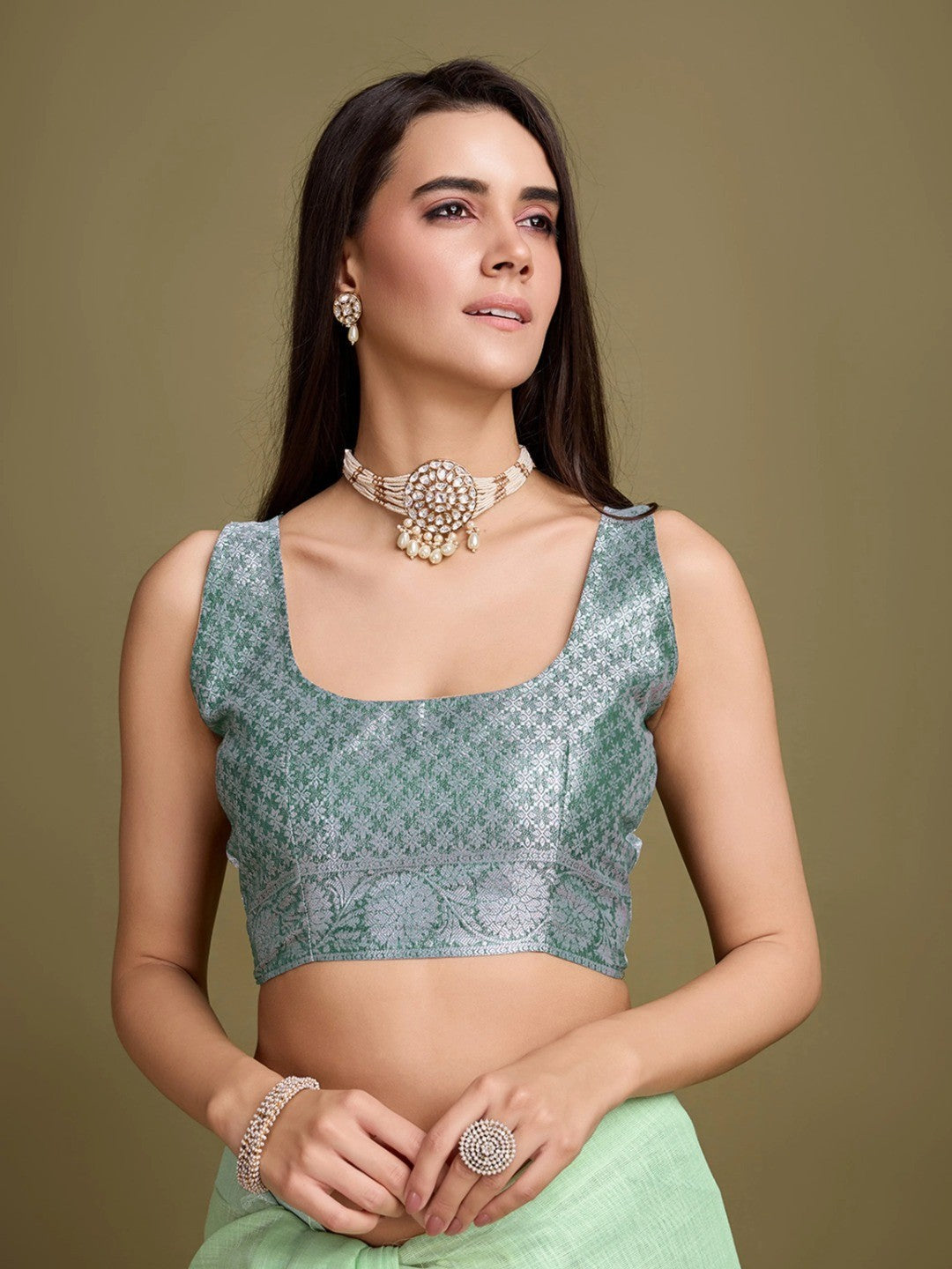 Sophisticated Green Linen Saree Featuring Intricate Zari Weaving & Tassel Accents - Image 3