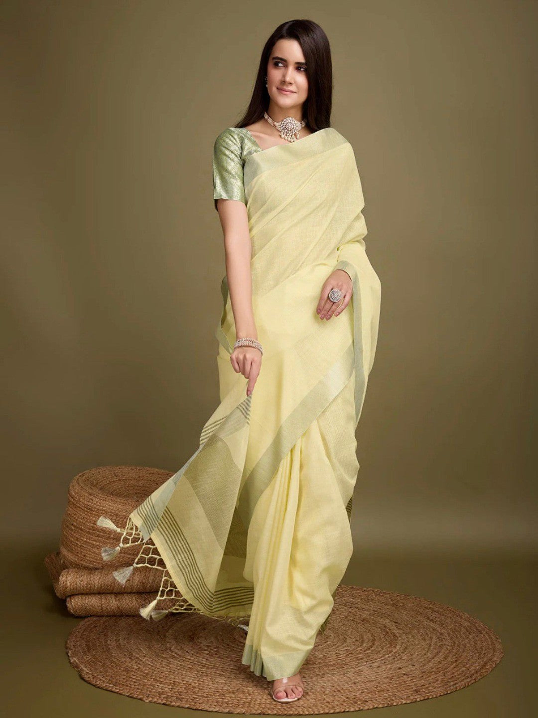 Sophisticated Yellow Linen Saree Featuring Intricate Zari Weaving & Tassel Accents - Image 1