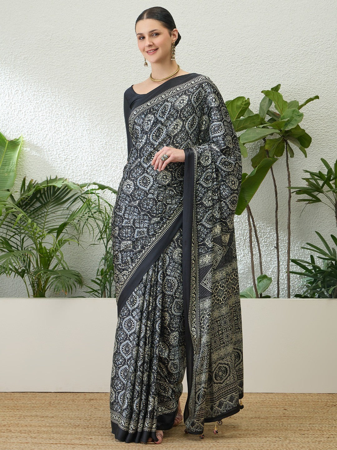 Sophisticated Black Floral Print Satin Saree With Ethnic Latkan Pallu - Image 1