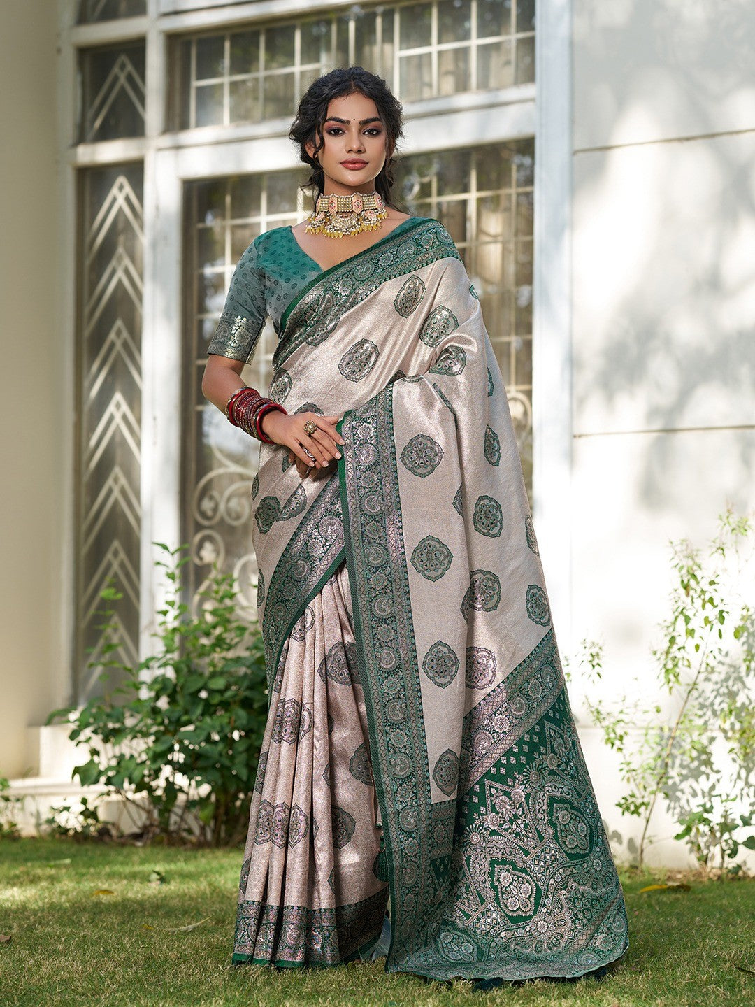 Graceful Cream & Green Floral Weaving Silk Blend Saree Enhanced With Designer Tassel Pallu - Image 1