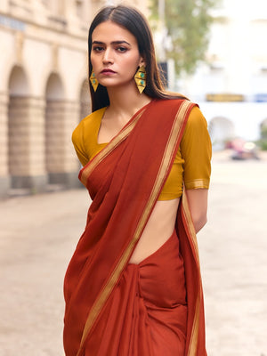 Charming Rust Solid Mulmul Cotton Saree Highlighted By Zari Weaving Border & Tassel Pallu - Image 2