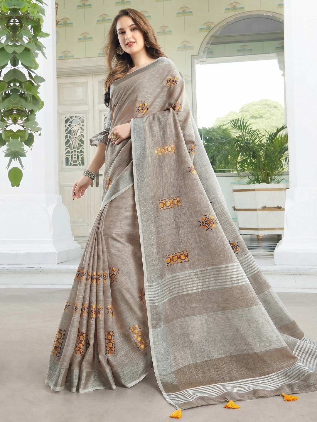 Classy Pastel Brown Colored Casual Wear Floral Embroidered Linen-Cotton Saree With Tassels - Image 1