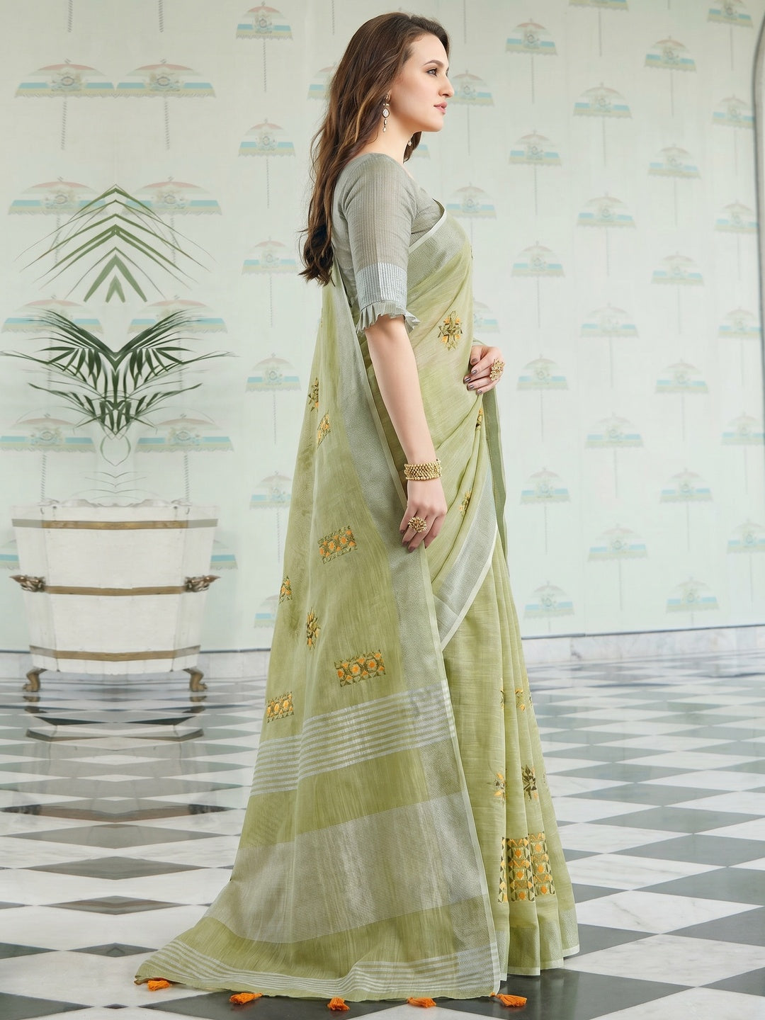 Arresting Pastel Green Colored Casual Wear Floral Embroidered Linen-Cotton Saree With Tassels - Image 1