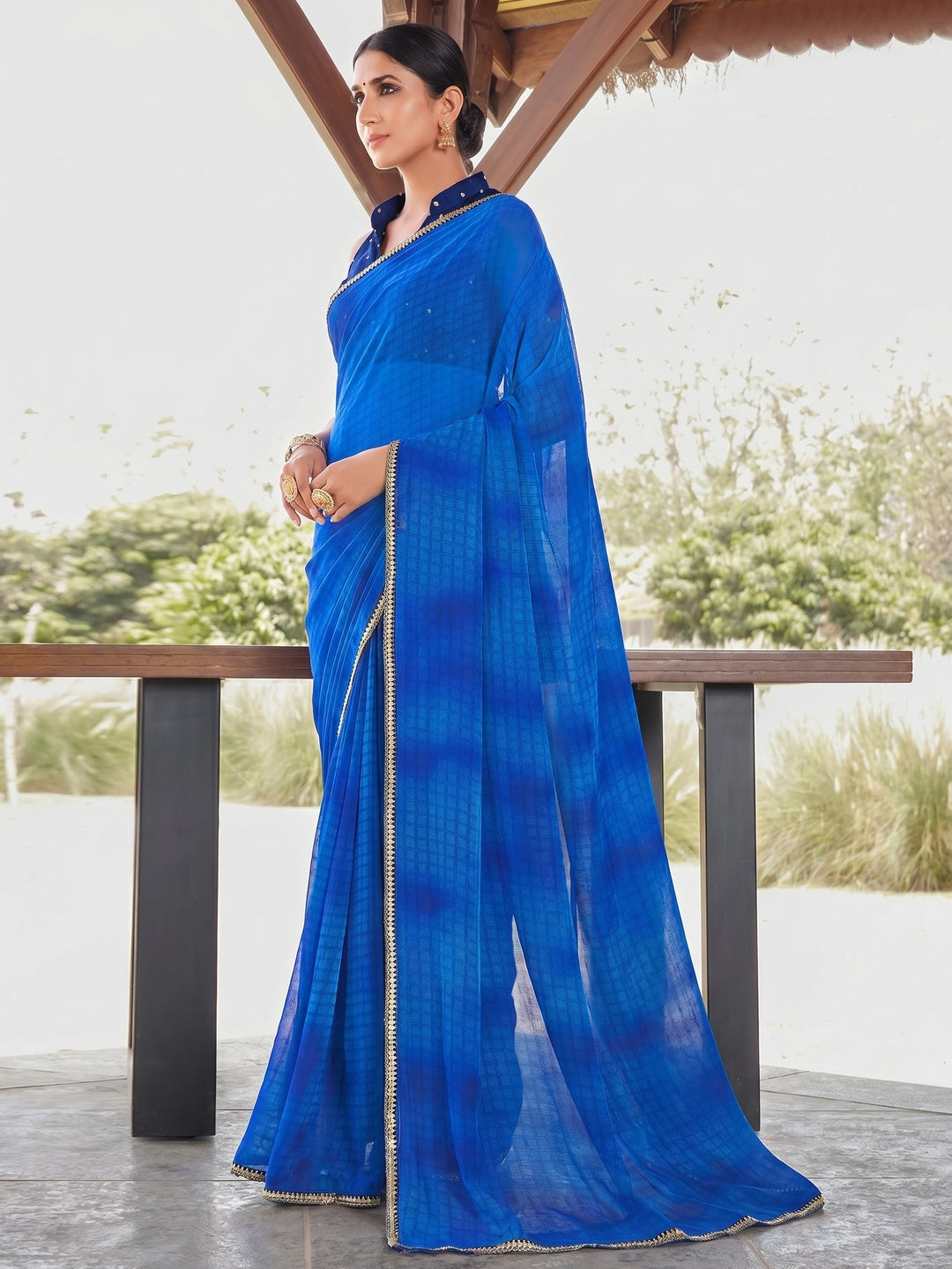 Blue Printed With Sequins Embroidered Border Georgette Saree - Image 1