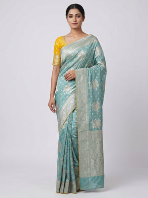 Turquoise Floral Woven Dola Silk Saree - Image 1