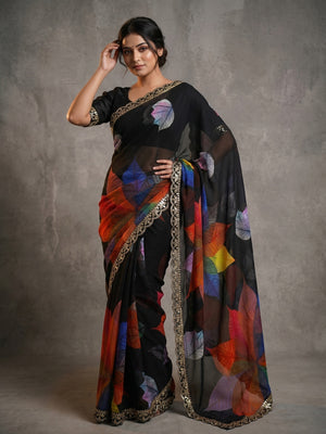Peachmode Black Georgette Saree with Multicolor Leaf Motifs - Image 1
