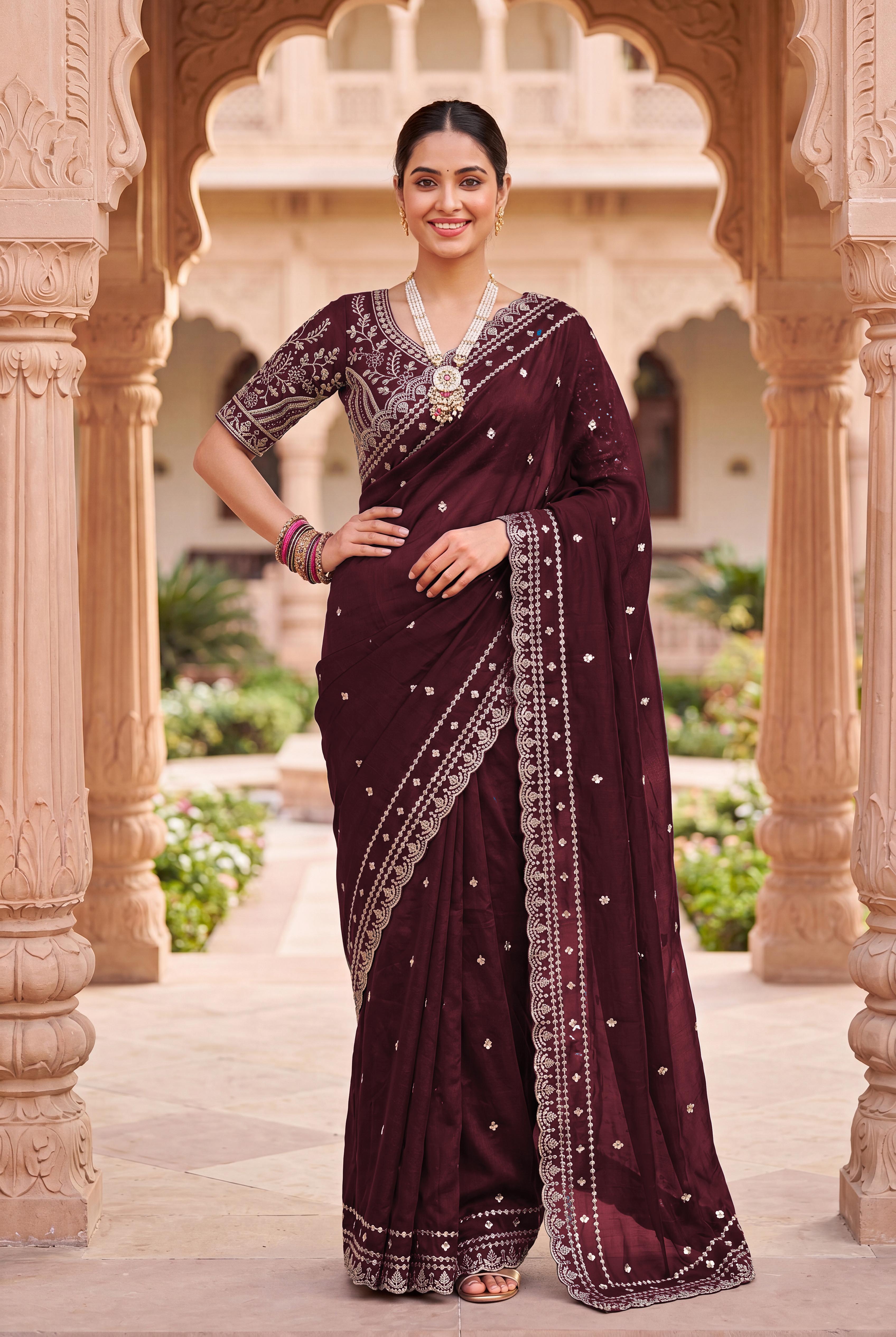 Luxurious Maroon  Floral Zari Embroidered Satin Saree Accented With Fine Sequins Work