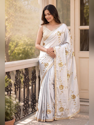 White Silk Blend Saree Featuring Delicate Floral Motifs in Shimmering Sequins - Image 1