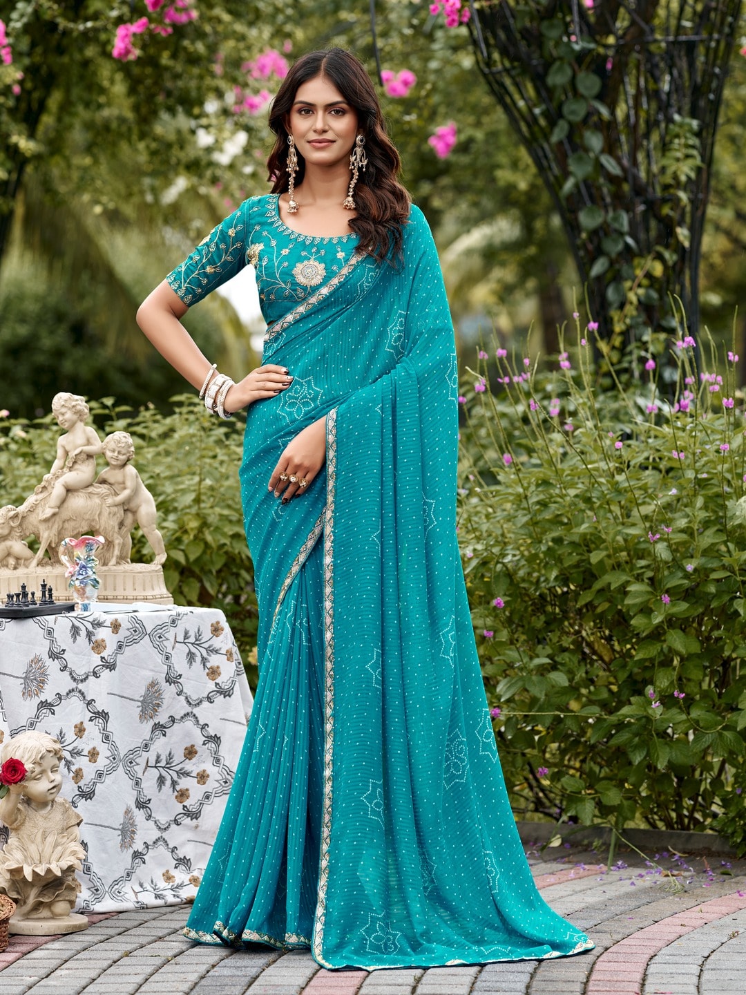 Peachmode Turquoise Bandhani Printed Georgette Saree With Embroidered Border - Image 1