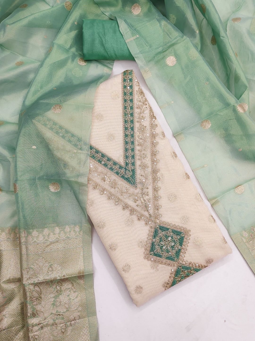 Peachmode Green Butti Weaving Shimmer Unstitched Dress Material With V-Neck Thread And Cording Embroidery - Image 1