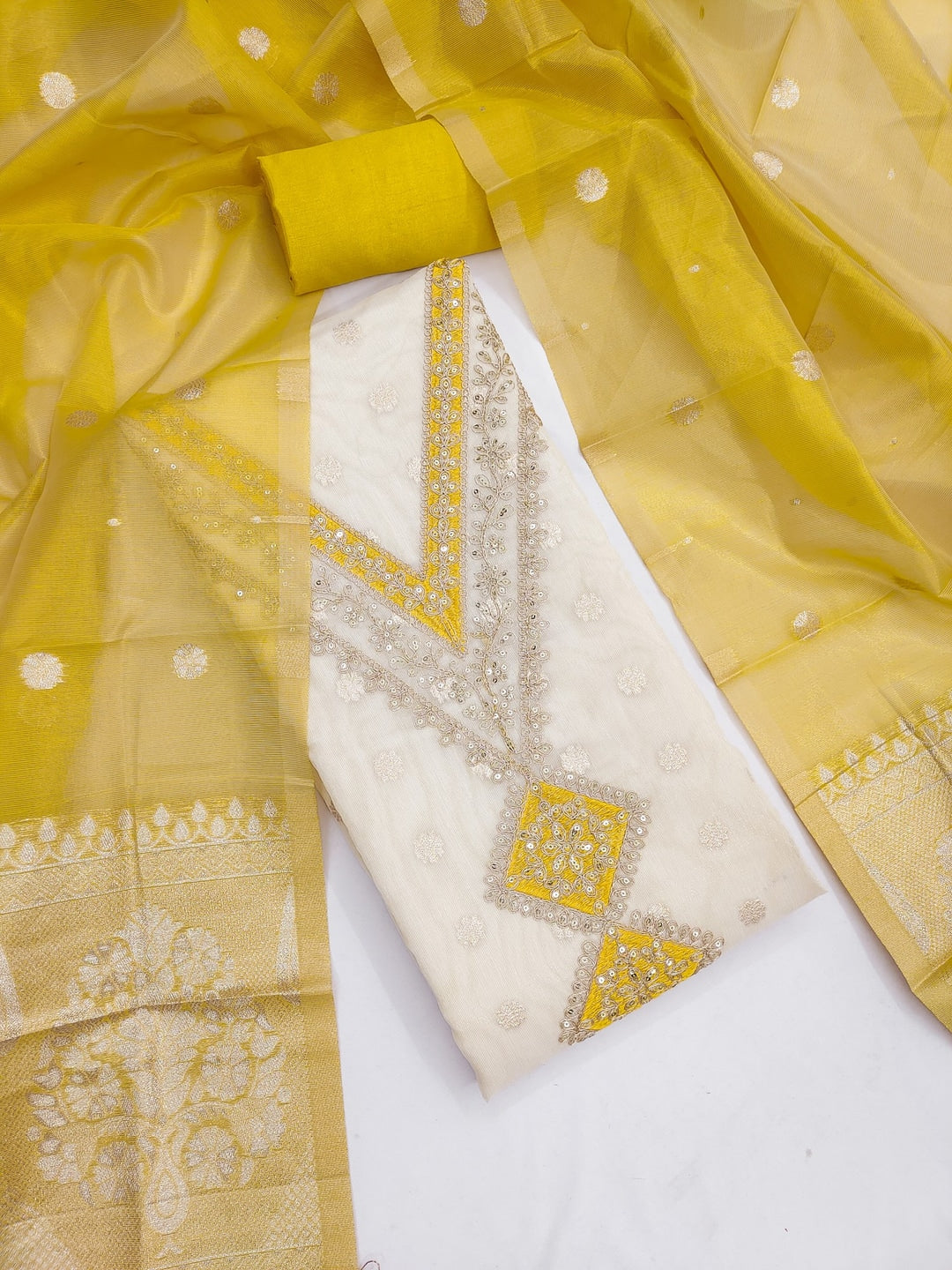 Peachmode Mustard Butti Weaving Shimmer Unstitched Dress Material With V-Neck Thread And Cording Embroidery - Image 1
