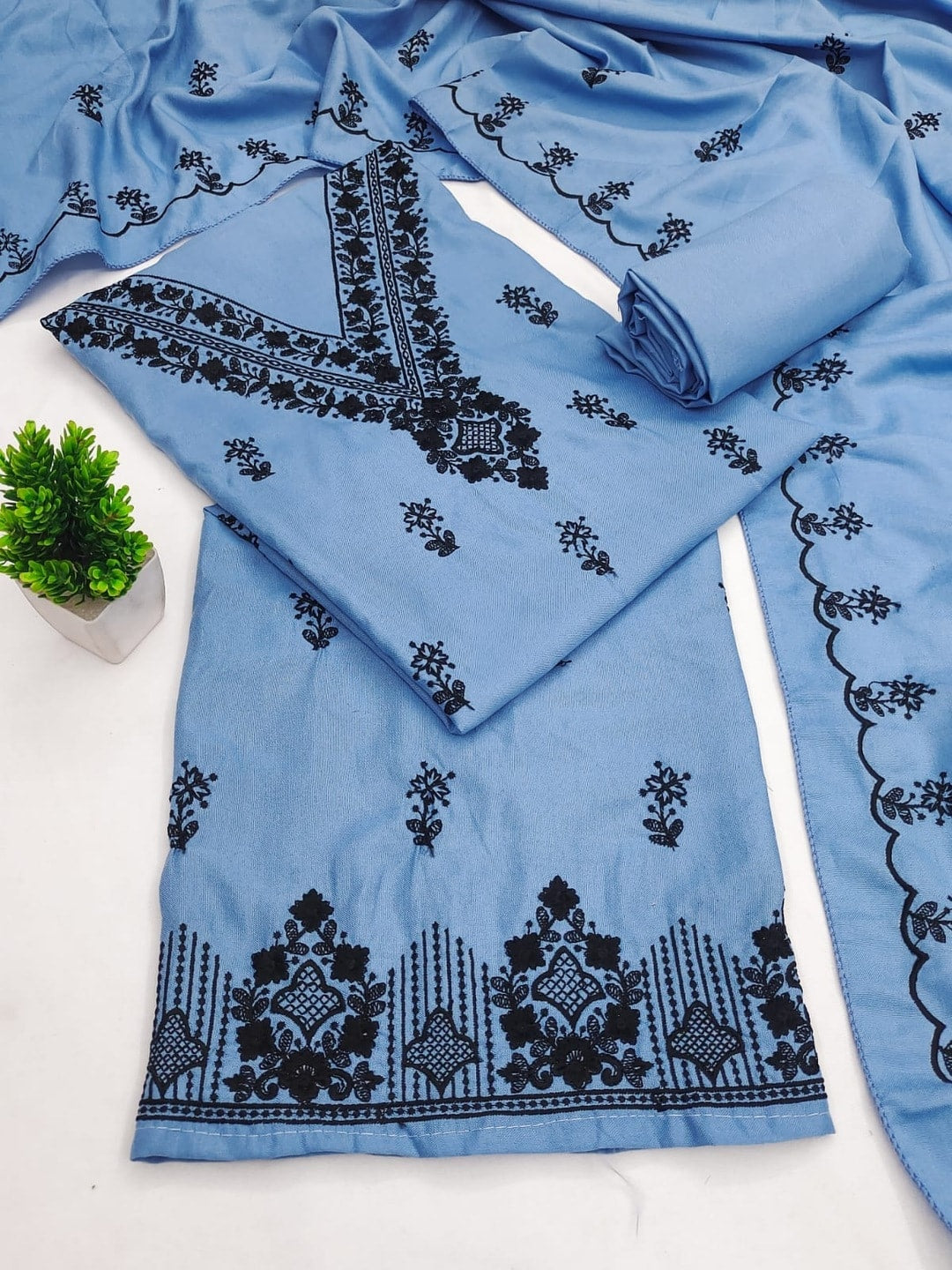 Peachmode Sky Blue Poly Rayon Unstitched Dress Material With Black Thread Embroidered V Neck And Daman Work And Embroidered Dupatta - Image 1