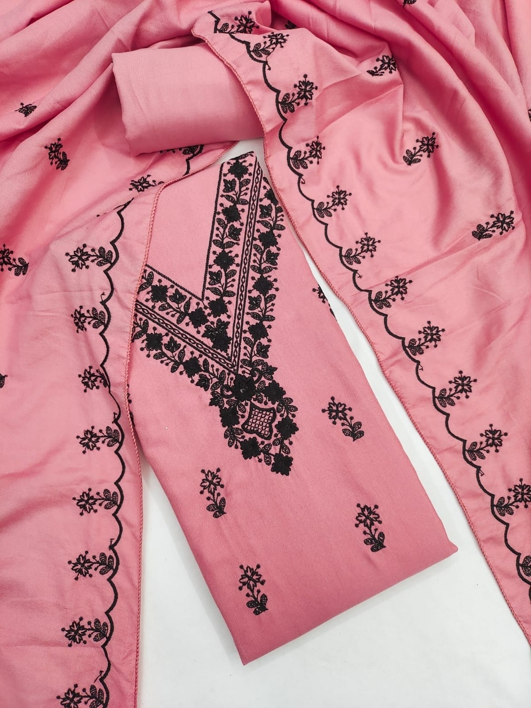 Peachmode Pink Poly Rayon Unstitched Dress Material With Black Thread Embroidered V Neck And Daman Work And Embroidered Dupatta - Image 1