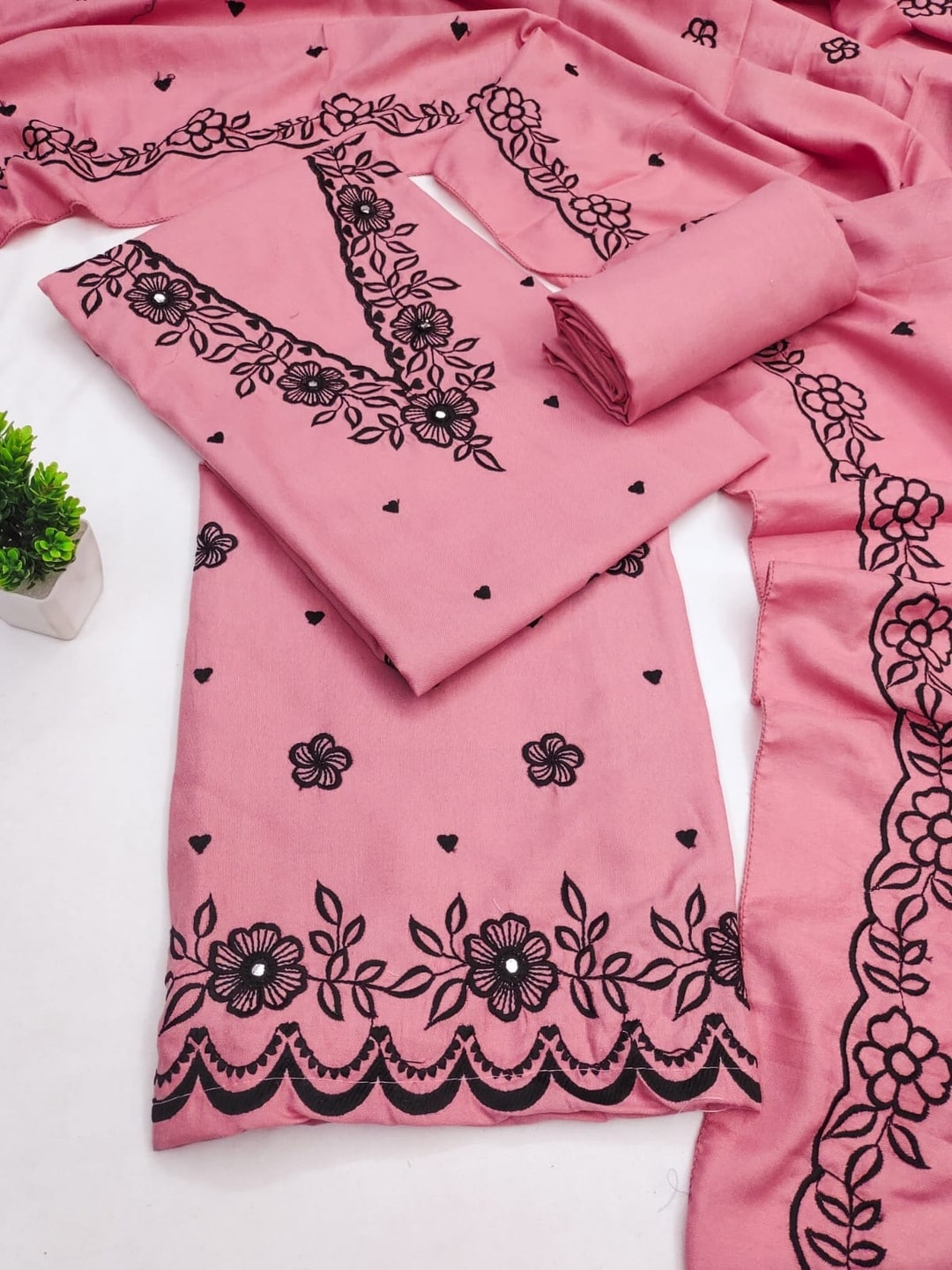 Peachmode Pink Poly Rayon Unstitched Dress Material With Black Floral Embroidered Neck And Daman Work And Embroidered Dupatta - Image 1