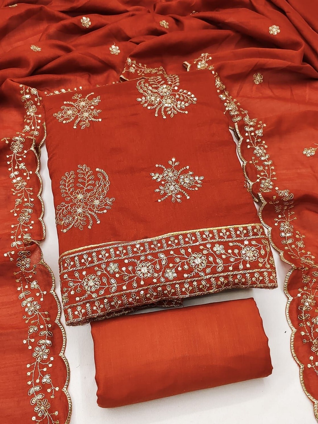 Peachmode Rust Vichitra Silk Unstitched Dress Material With Gold Butterfly Floral Sequence Work And Scalloped Embroidered Dupatta - Image 1