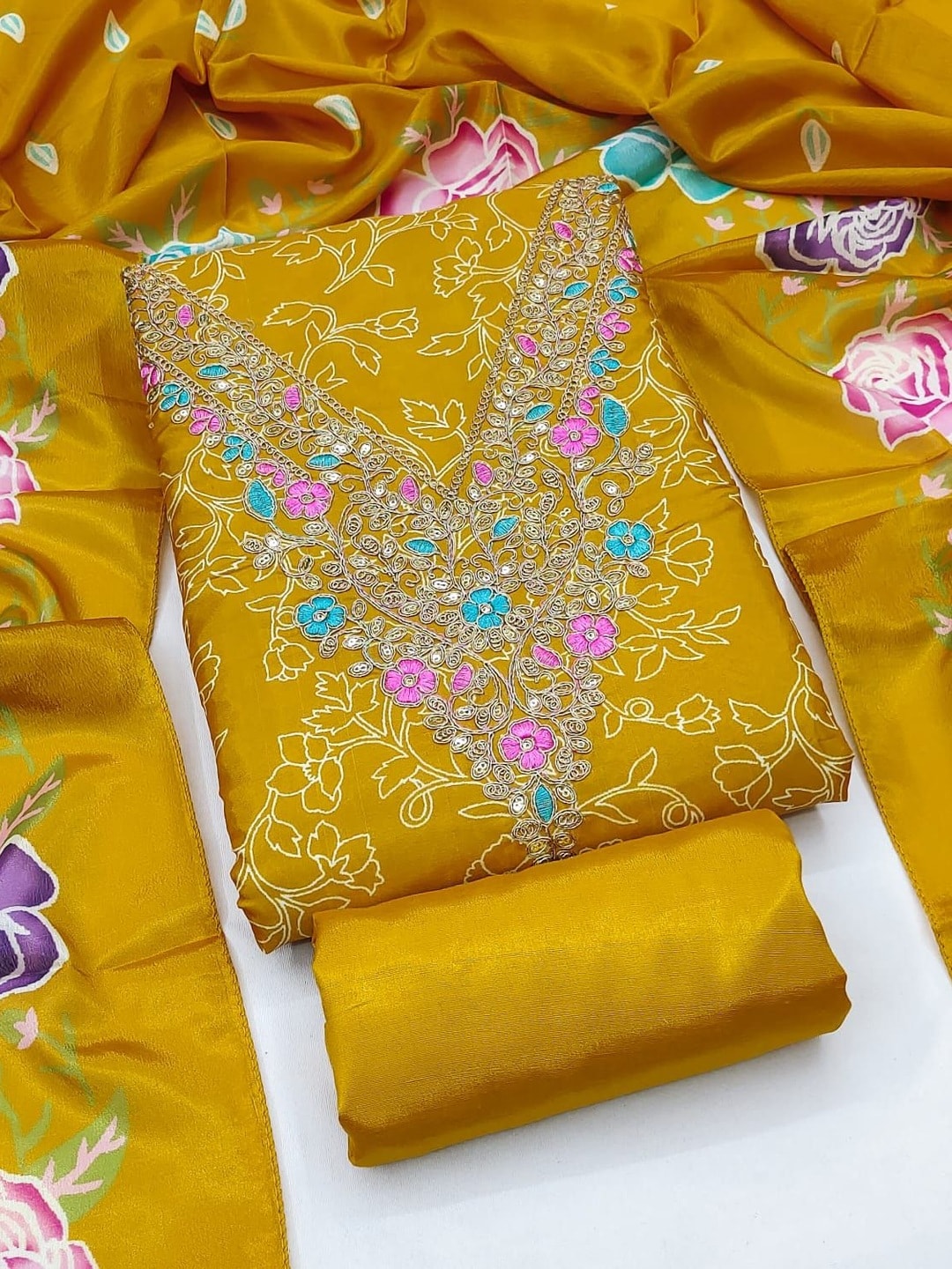 Peachmode Mustard French Crepe Unstitched Dress Material With Embroidered Floral Neck And Digital Rose Print Chinon Dupatta - Image 1