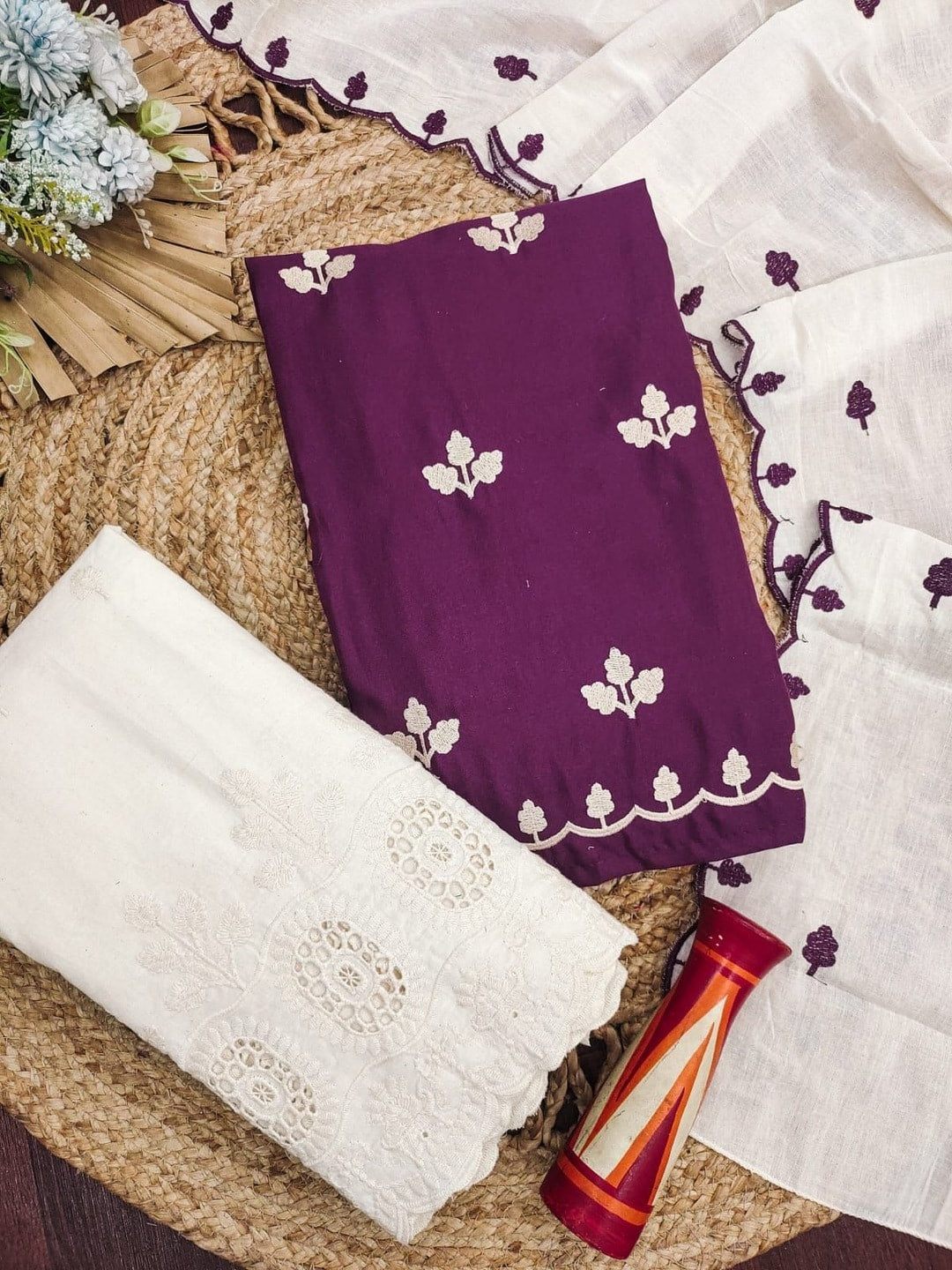 Peachmode Wine Poly Rayon Unstitched Dress Material With Leaf Buti Embroidery And Schiffli Cambric Cotton Bottom And Dupatta - Image 1