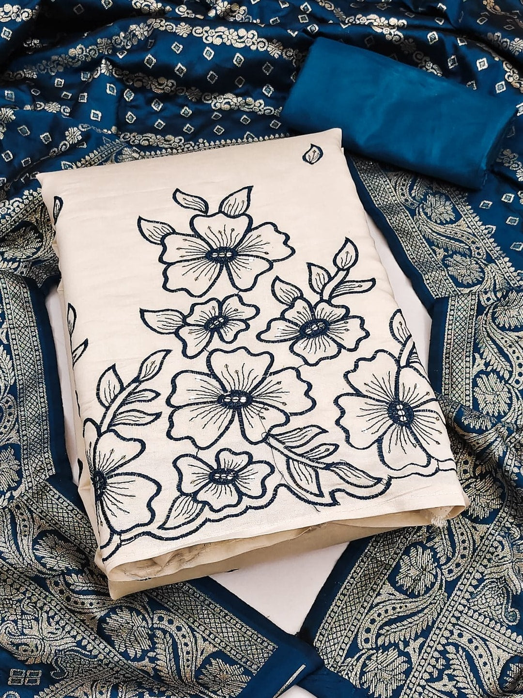 Peachmode Peacock Blue Roman Silk Unstitched Dress Material With Multi Sequence Floral Embroidery And Banarasi Silk Jacquard Dupatta - Image 1