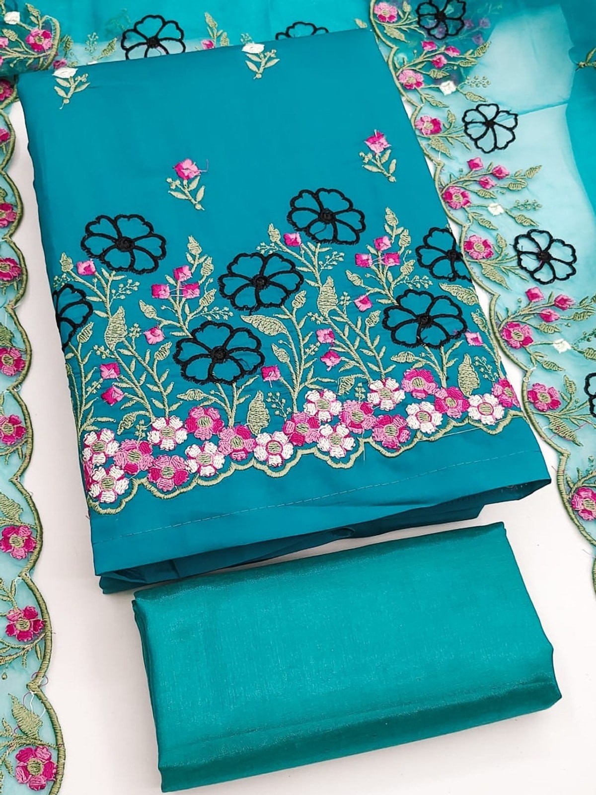 Peachmode Teal Roman Silk Unstitched Dress Material With Multi Floral Embroidery And Organza Dupatta - Image 1