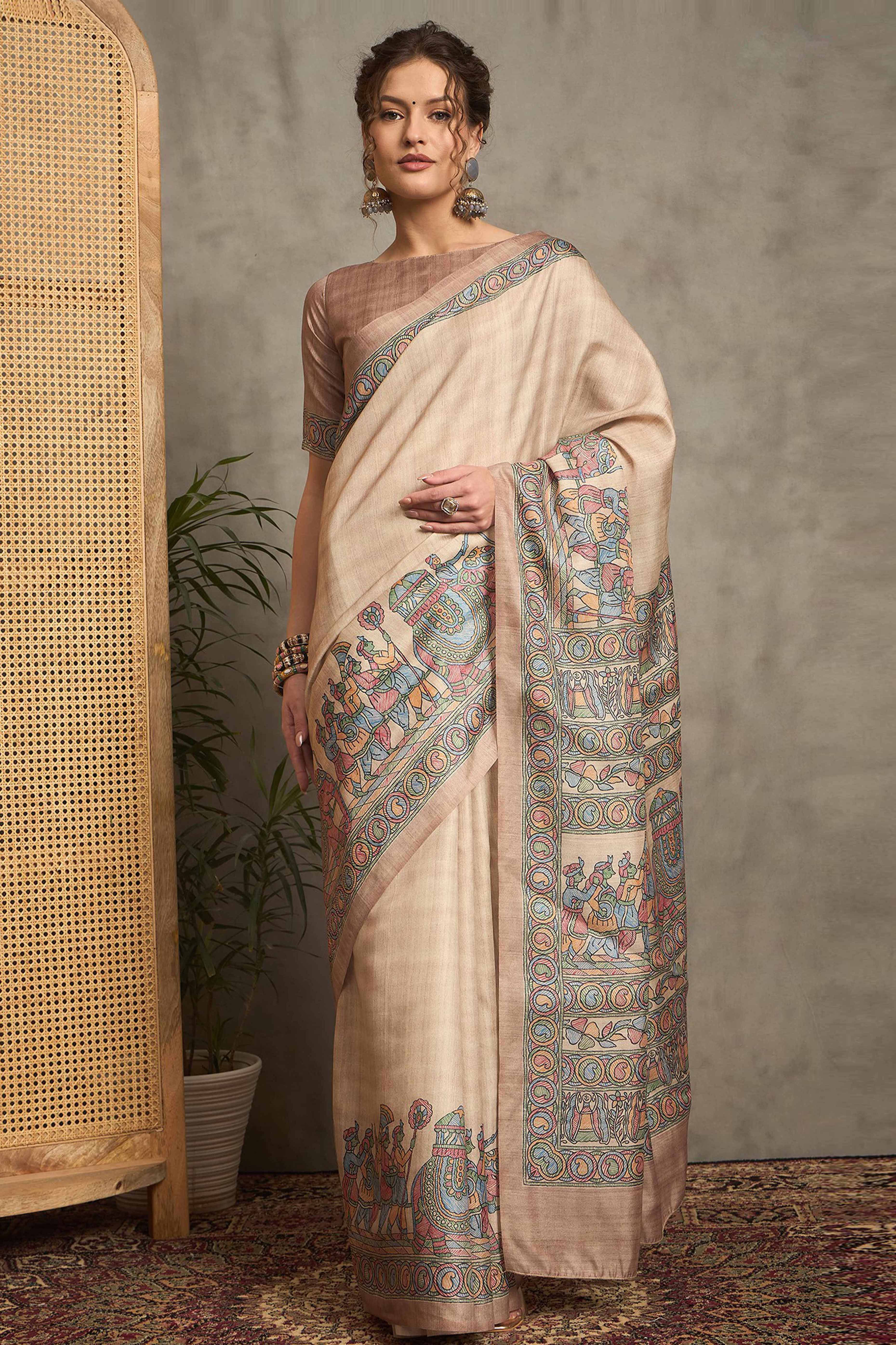 Cream Colored Art Silk Saree Featuring Artistic Madhubani Motifs