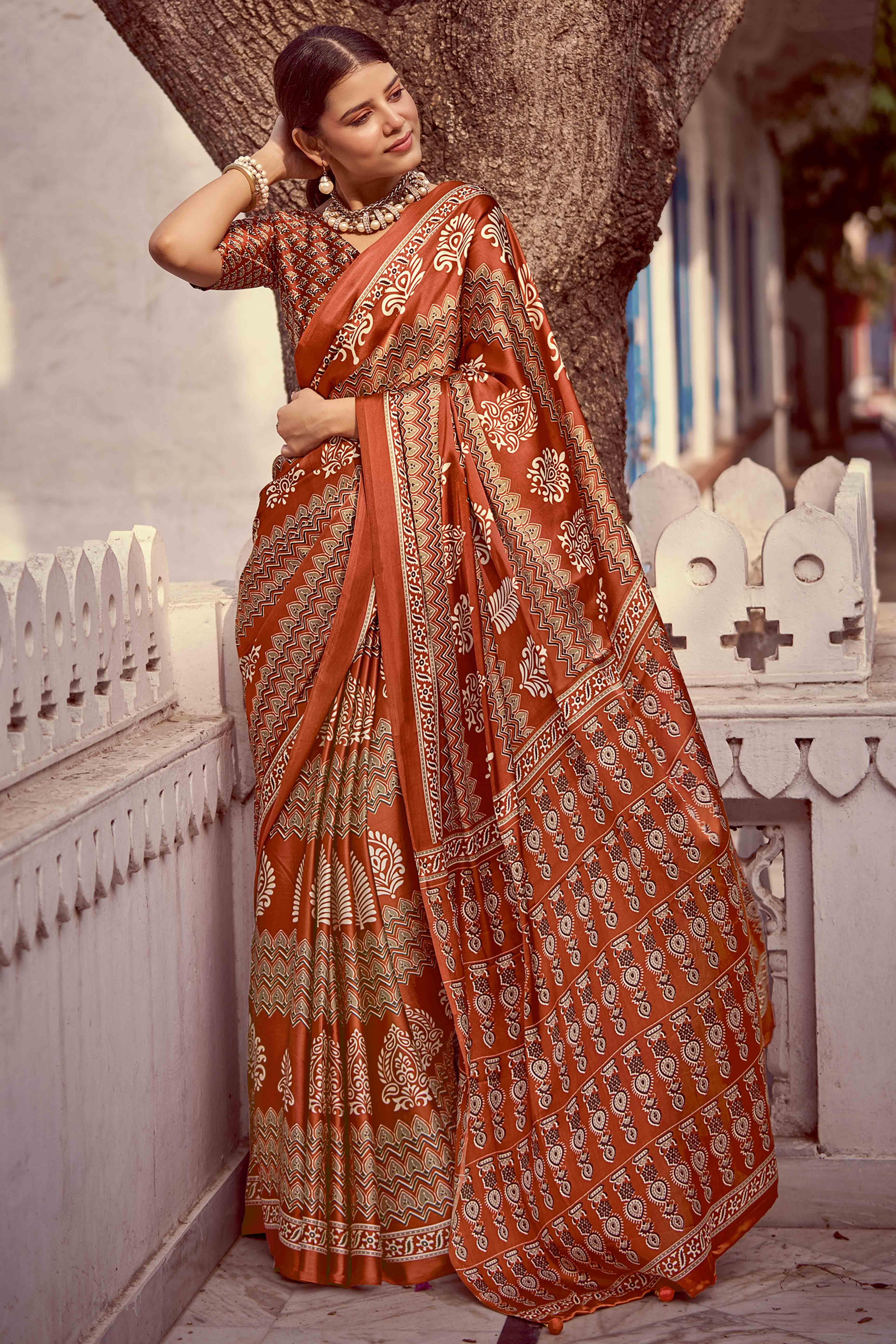 Rust Floral Ajrakh Printed Satin Saree With Tassels