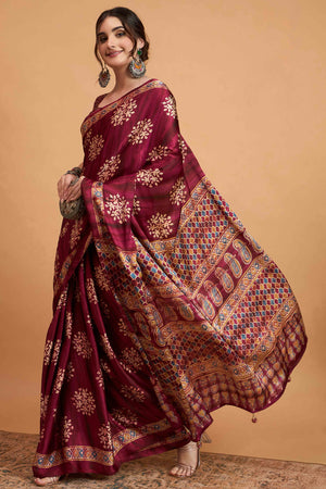 Wine Floral Ajrakh & Batik Print Saree In Luxurious Modal Satin With Tassel Pallu
