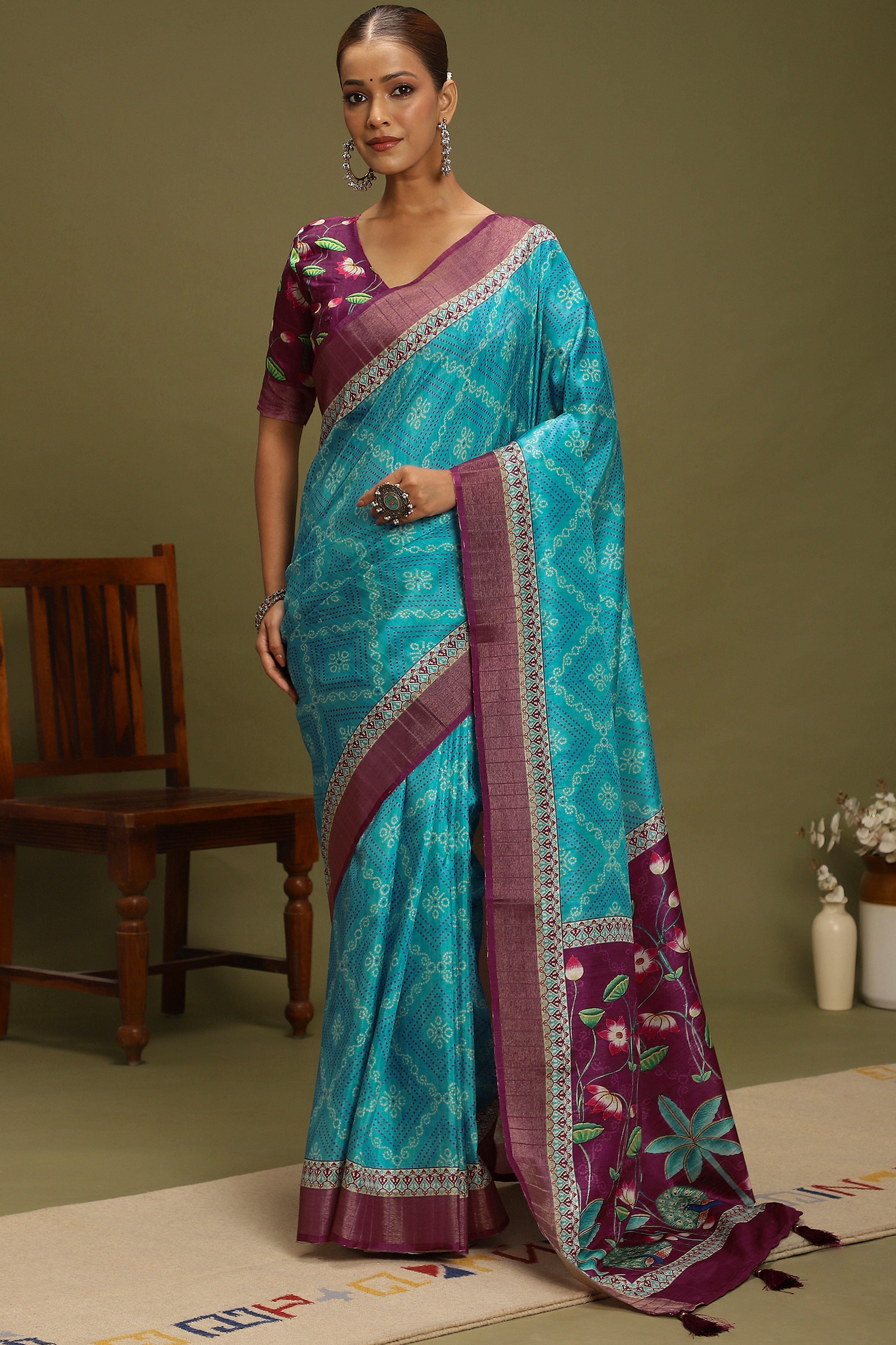 Turquoise Silk Blend Saree Decorated with Vibrant Bandhani Prints and Festive Detailing