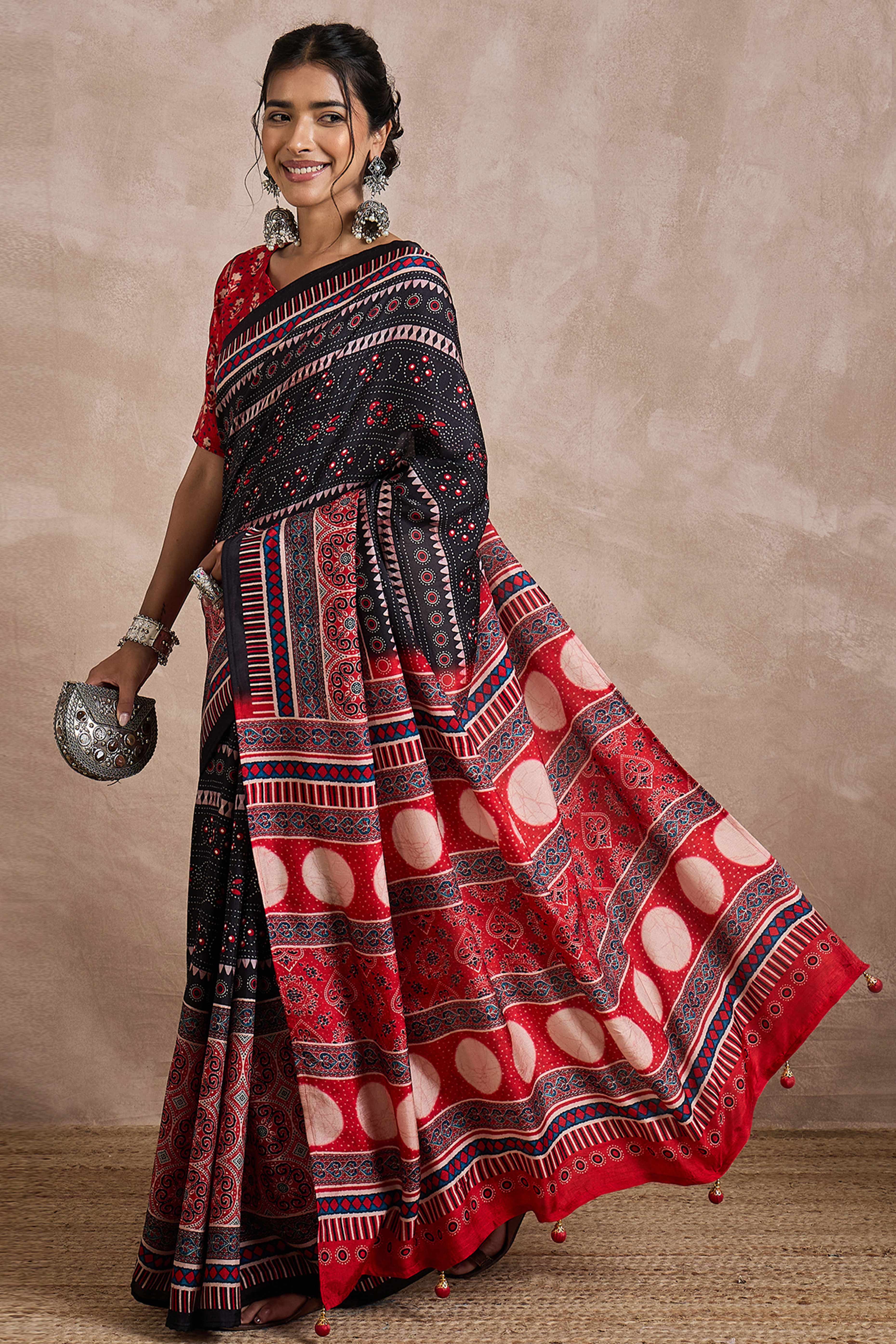 Black Dola Silk Saree Featuring Heritage Ajrakh Prints for Celebratory Occasions