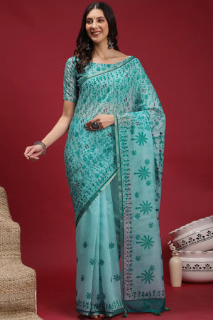 Turquoise Linen Cotton Saree Featuring Traditional Warli Prints & Tassel Pallu
