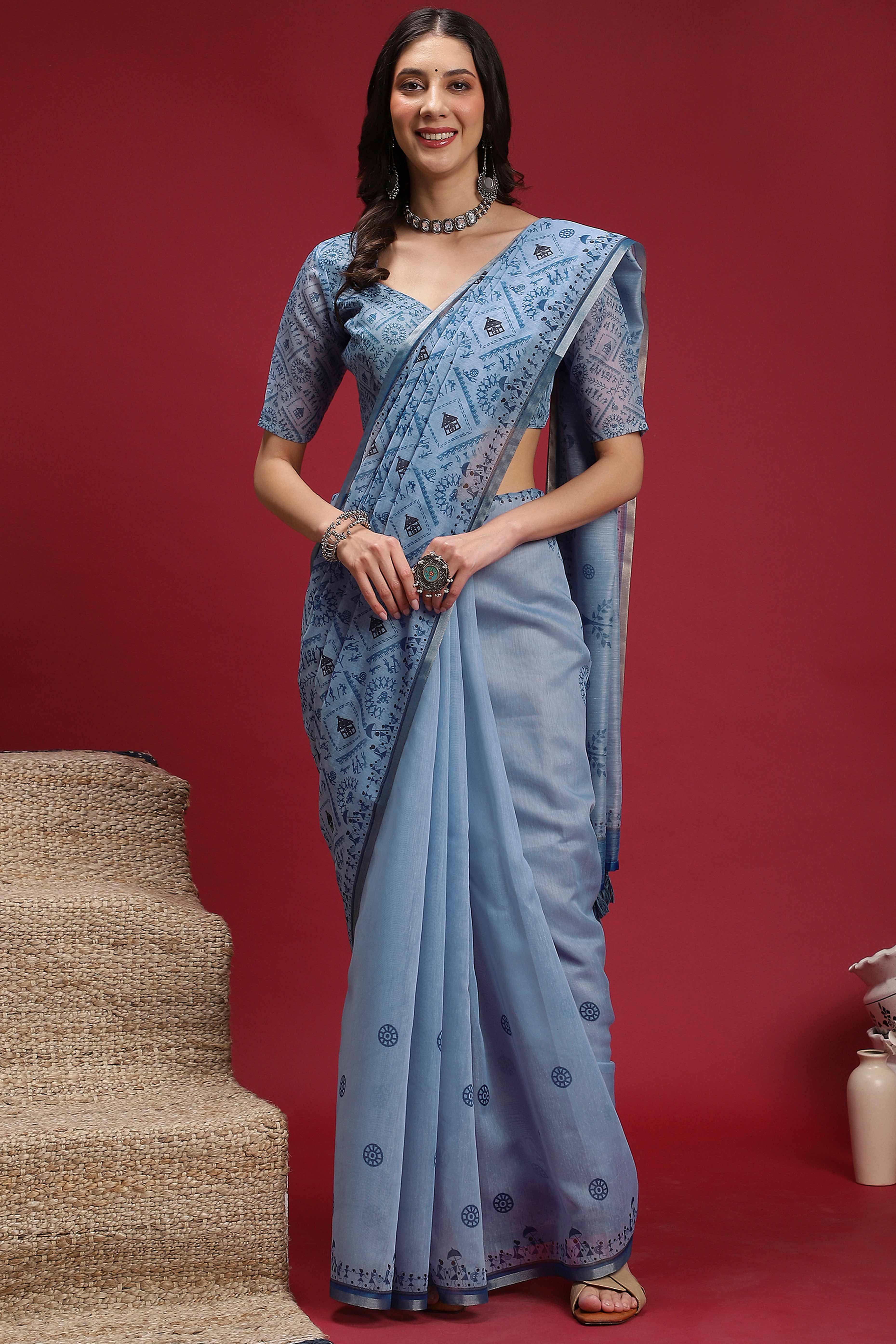 Light Blue Linen Cotton Saree Featuring Traditional Warli Prints & Tassel Pallu