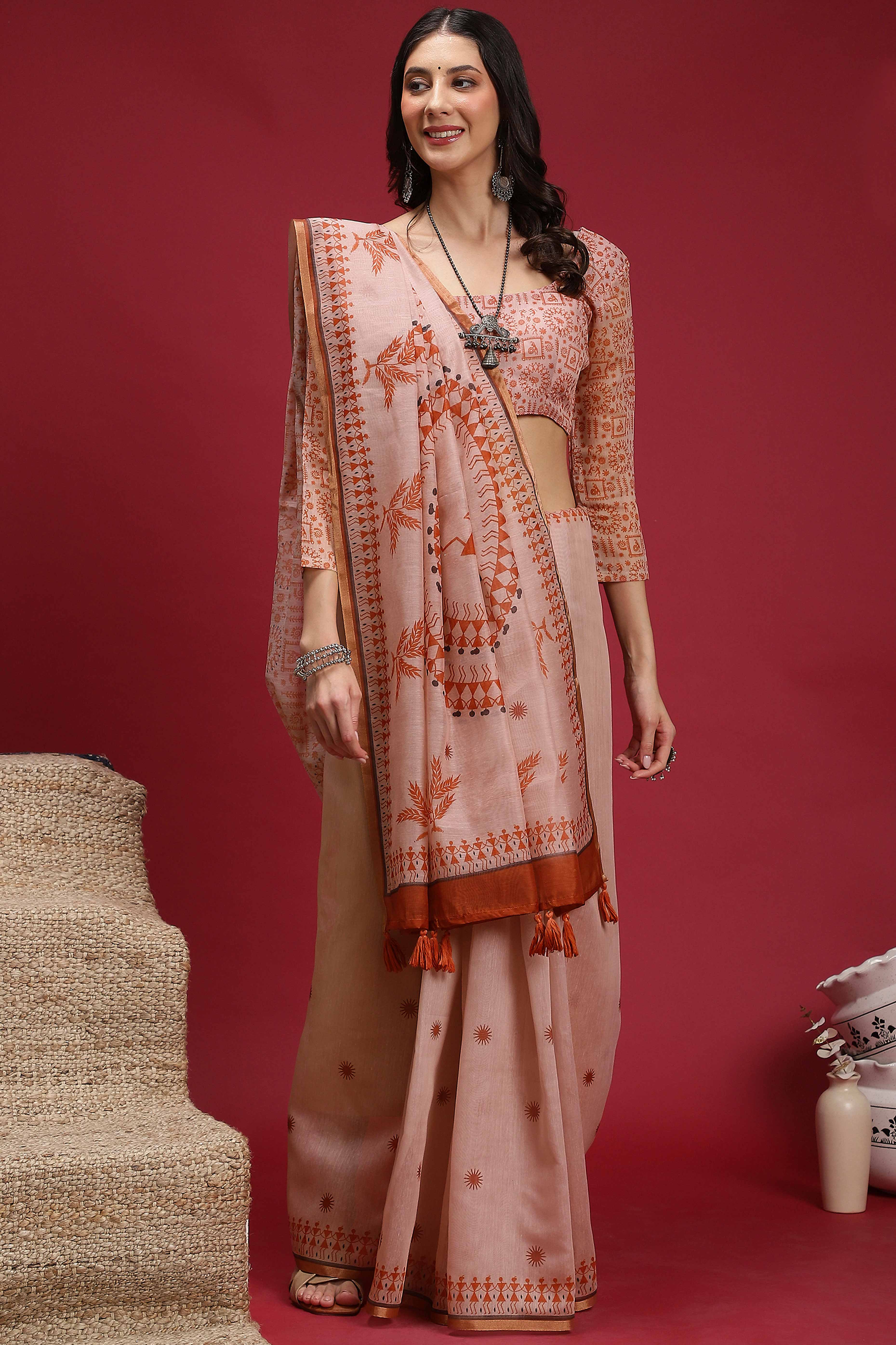 Light Peach Linen Cotton Saree Featuring Traditional Warli Prints & Tassel Pallu