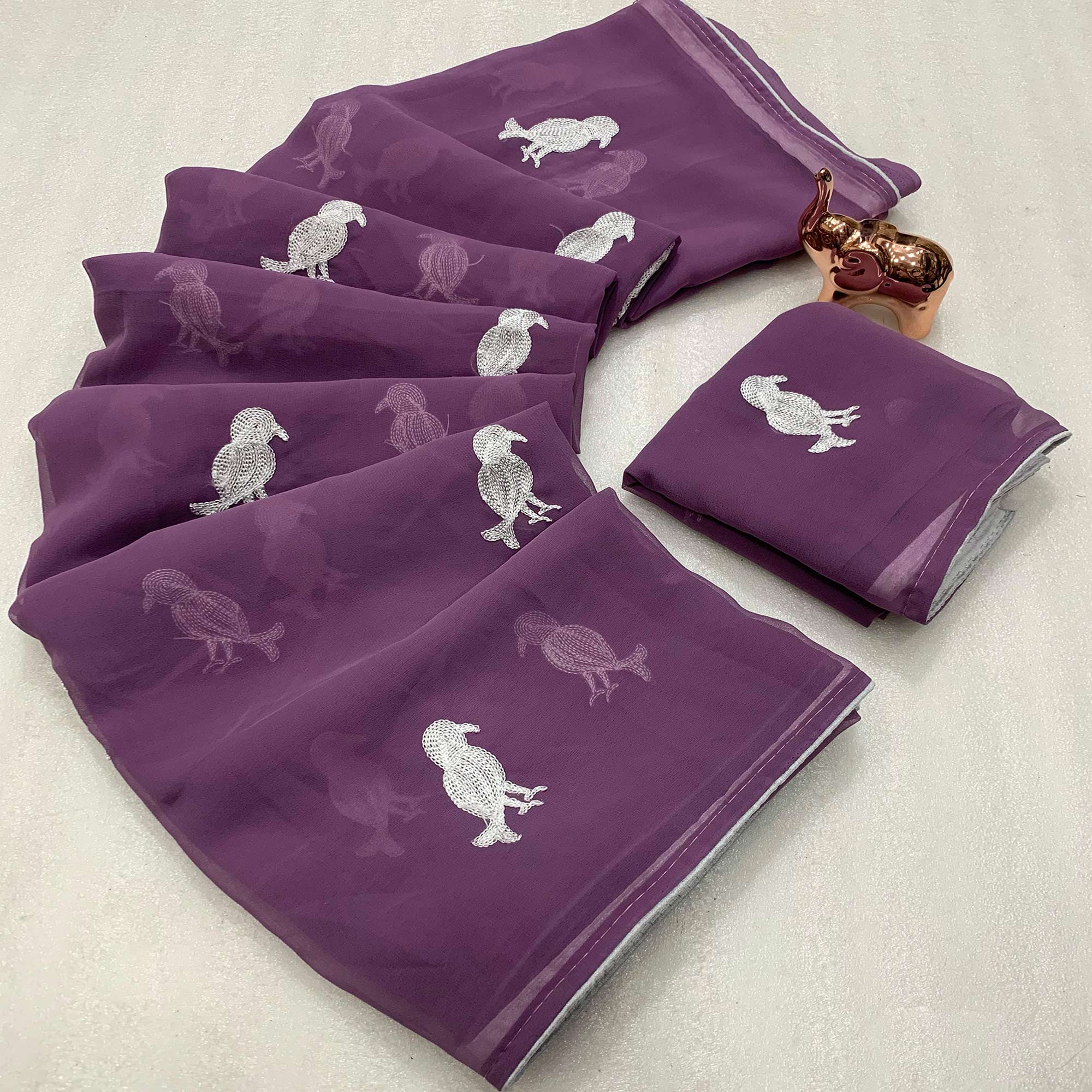 Light Purple Georgette Saree Adorned With Elegant Bird Embroidery