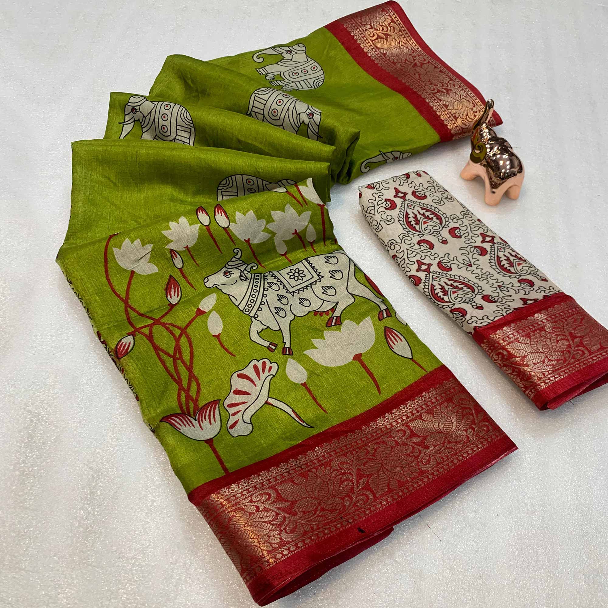 Heritage Inspired Green Mulmul Saree Featuring Pichwai Art Prints