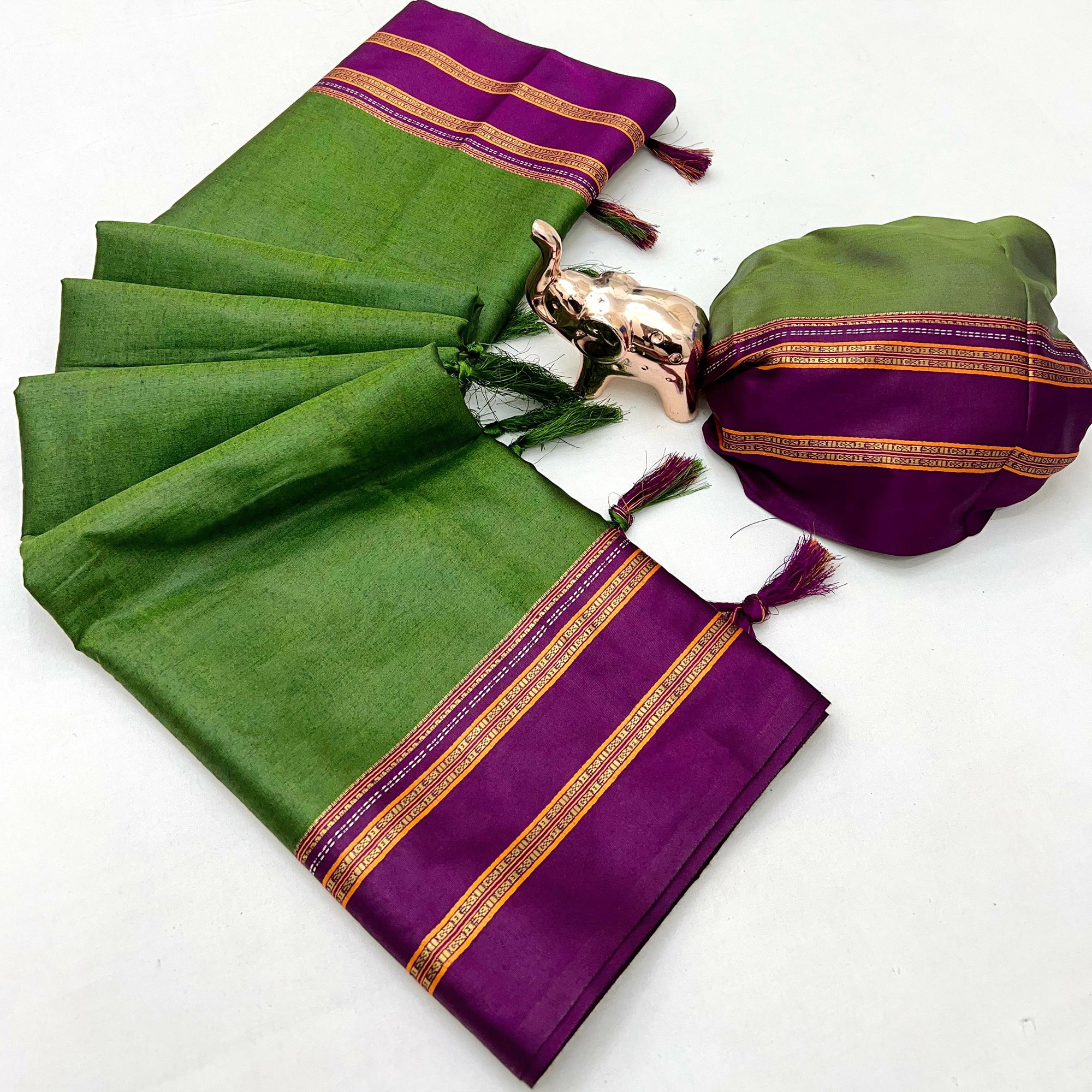 Classic Green Solid Weaving Pure Silk Saree Accented With Woven Striped Pallu & Tassel Finish