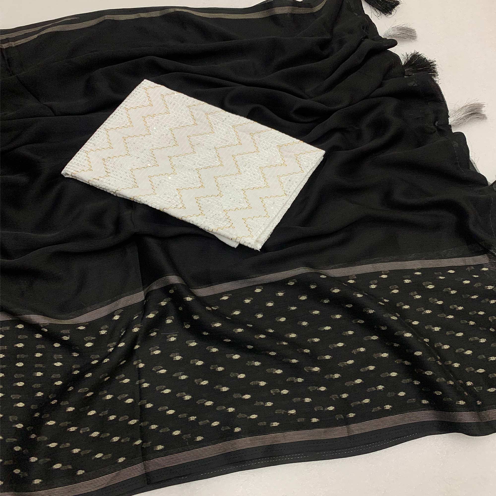 Black Woven Georgette Saree With Tassels