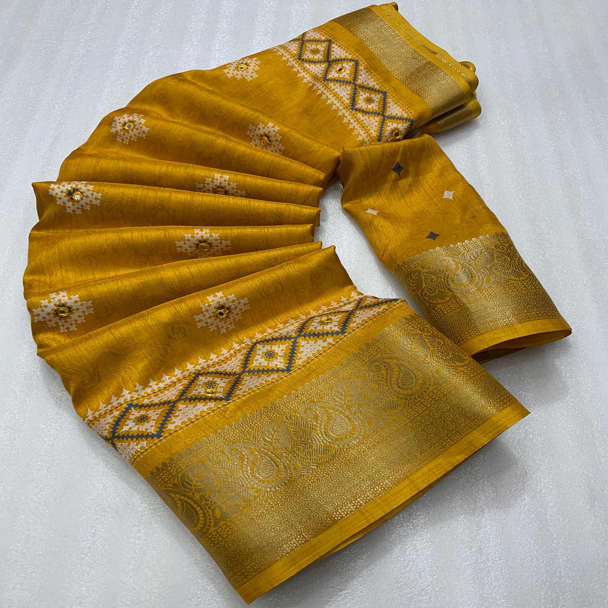 Mustard Printed With Mirror Work Crepe Saree With Tassels