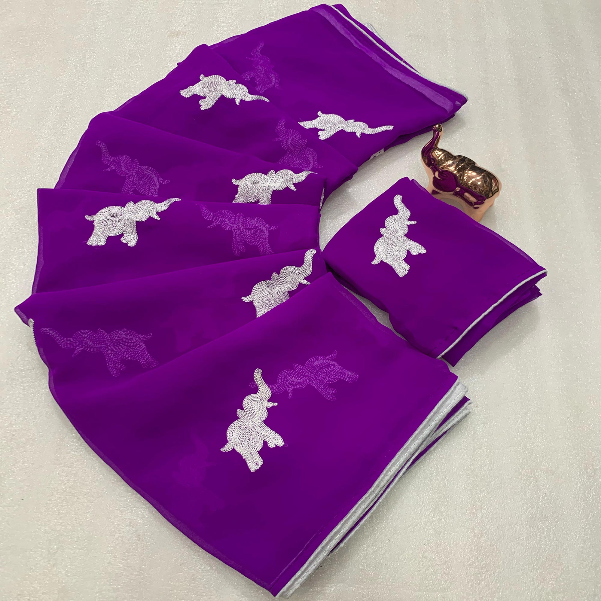 Purple Georgette Saree Featuring Exquisite Elephant Embroidery