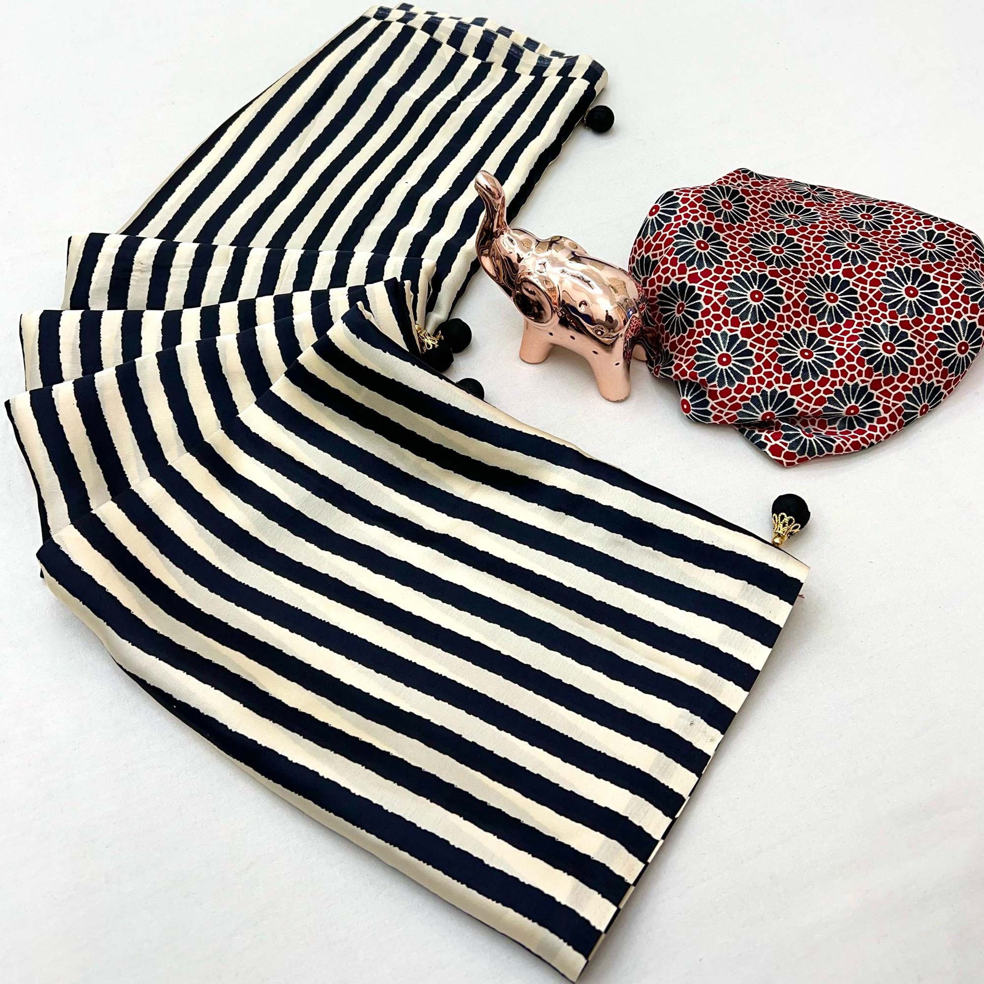 Luxe Partywear Saree in Black Satin with Modern Striped Print and Flowing Drape