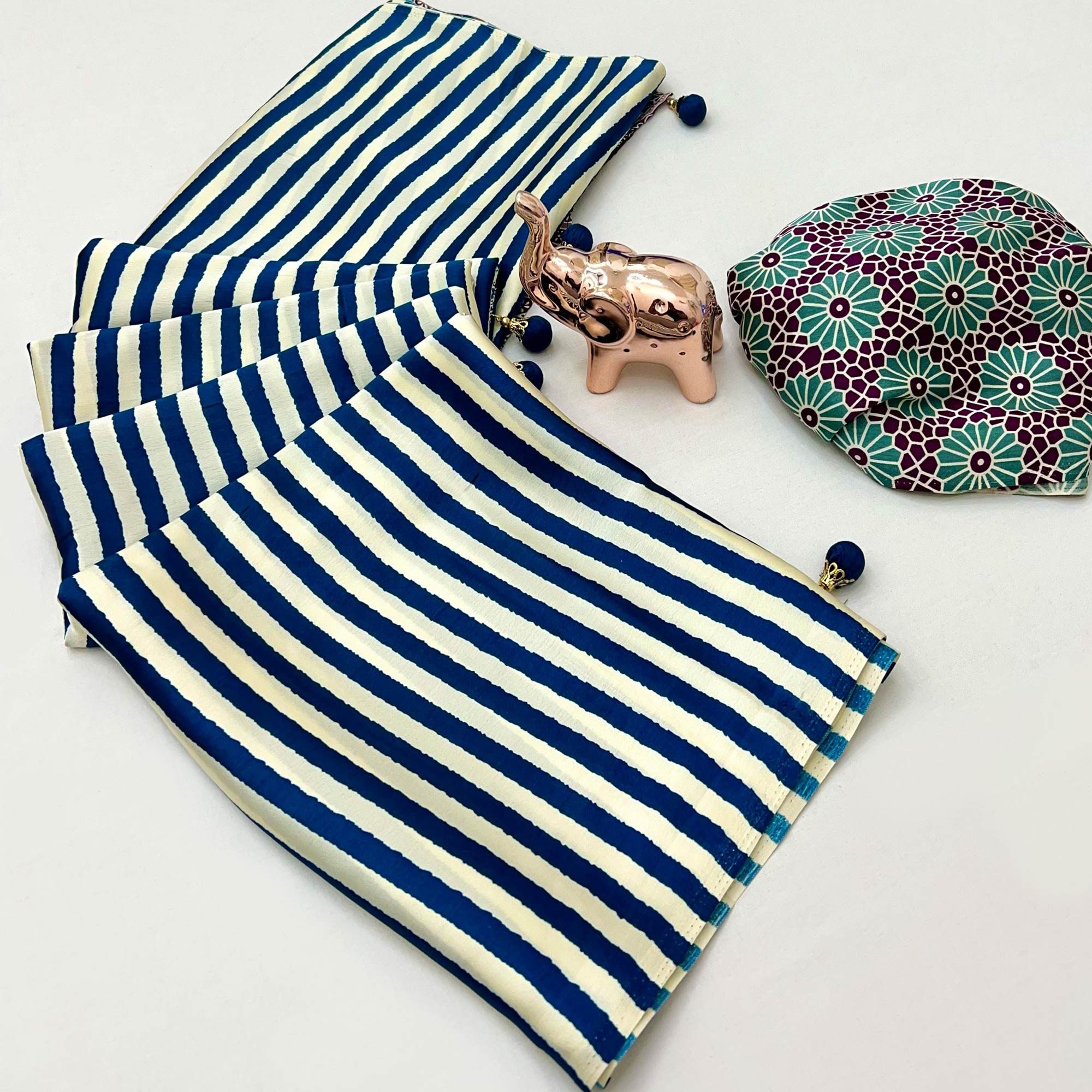 Luxe Partywear Saree in Blue Satin with Modern Striped Print and Flowing Drape
