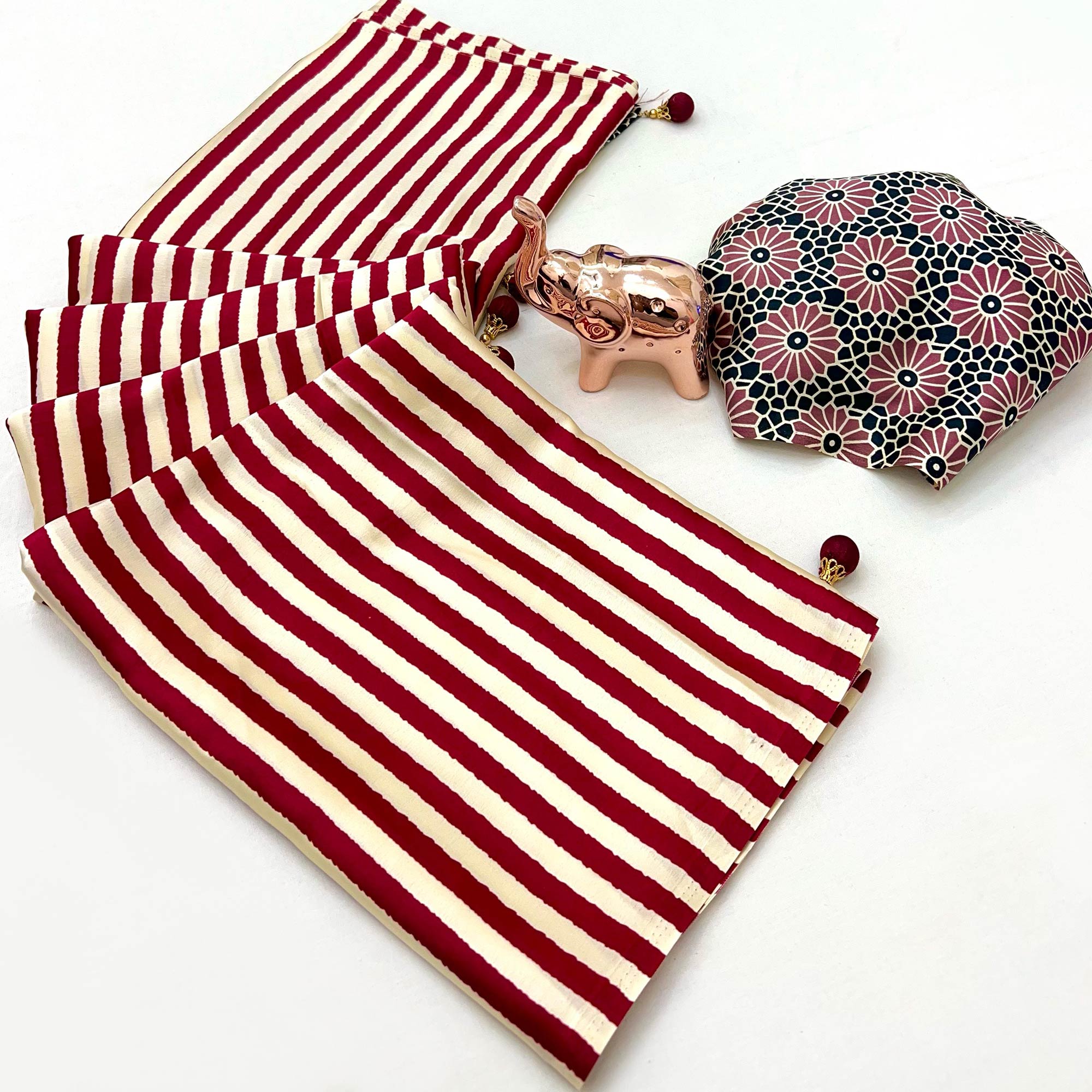 Luxe Partywear Saree in Maroon Satin with Modern Striped Print and Flowing Drape