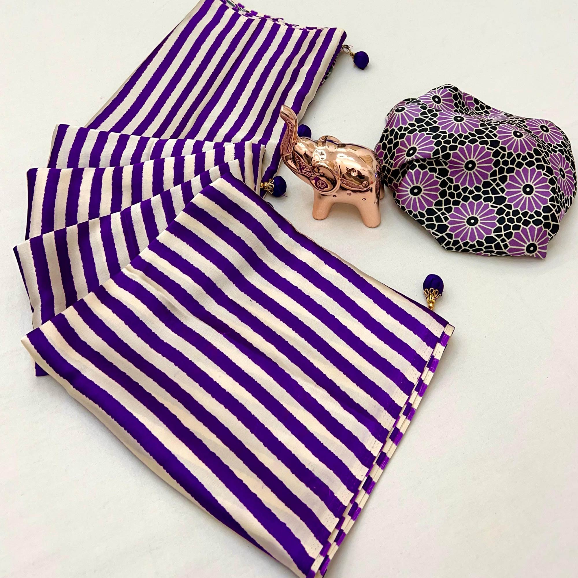 Luxe Partywear Saree in Violet Satin with Modern Striped Print and Flowing Drape