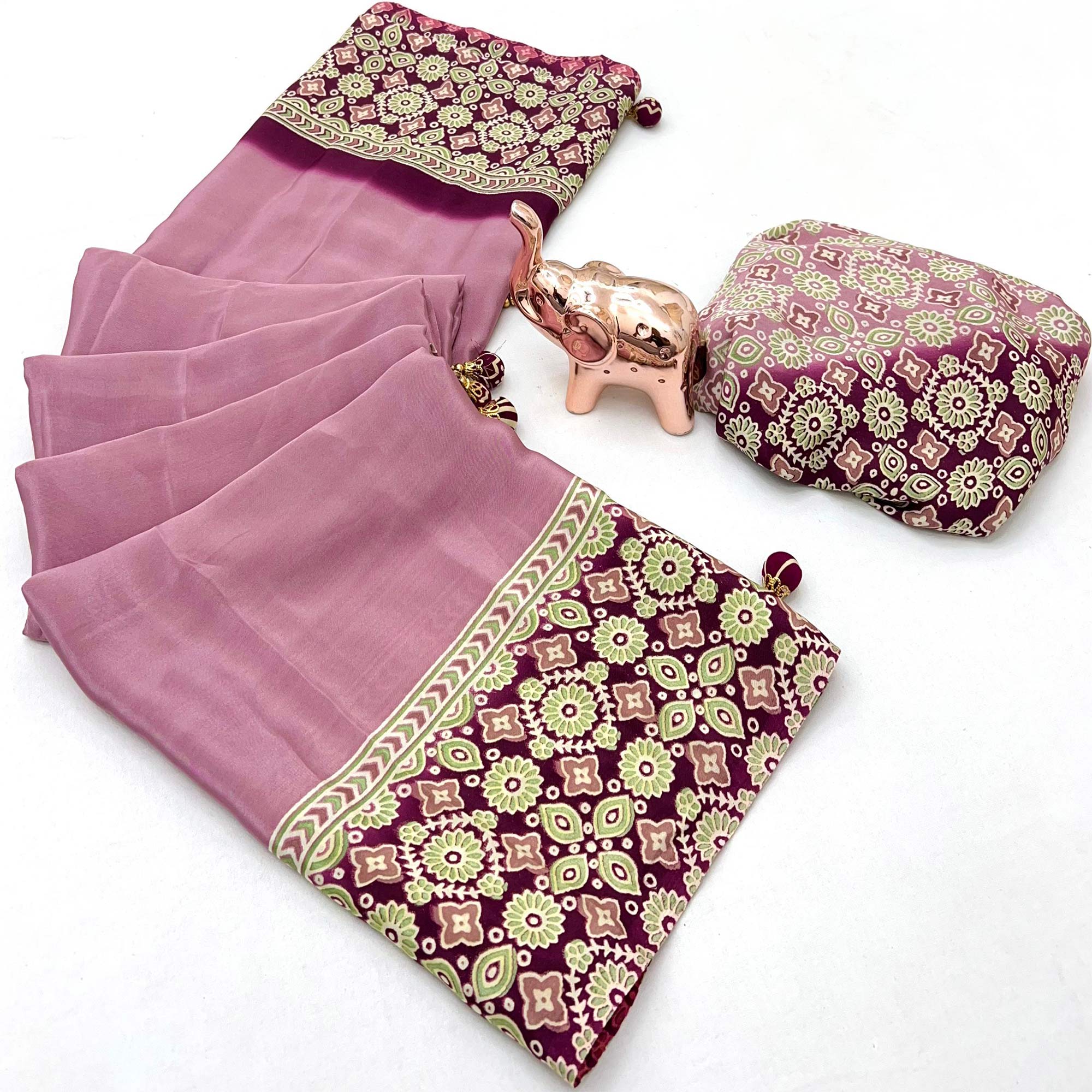 Dusty Rose Pink Solid Satin Saree Featuring Bold Ajrakh Print and Tassel Accented Pallu