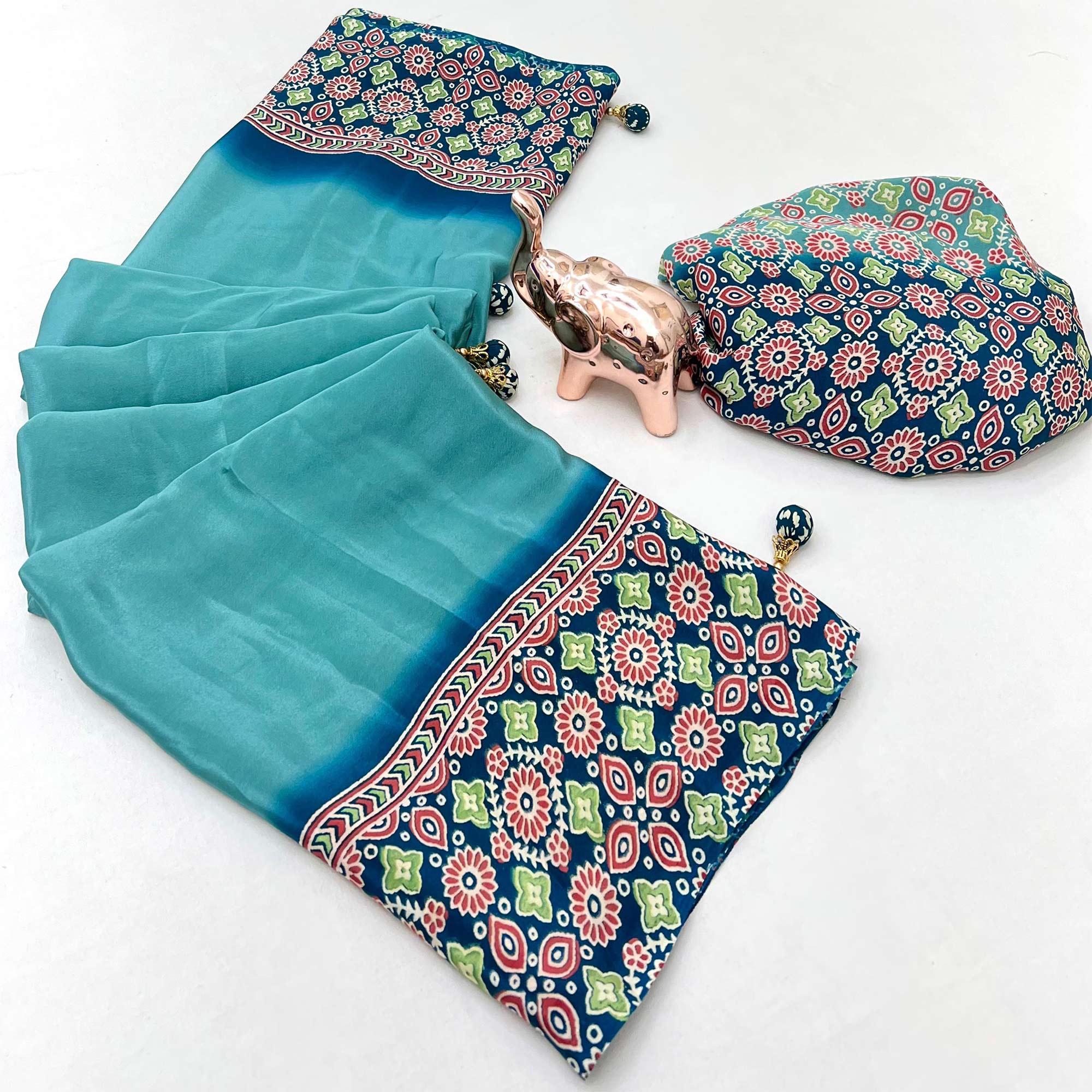 Turquoise Solid Satin Saree Featuring Bold Ajrakh Print and Tassel Accented Pallu