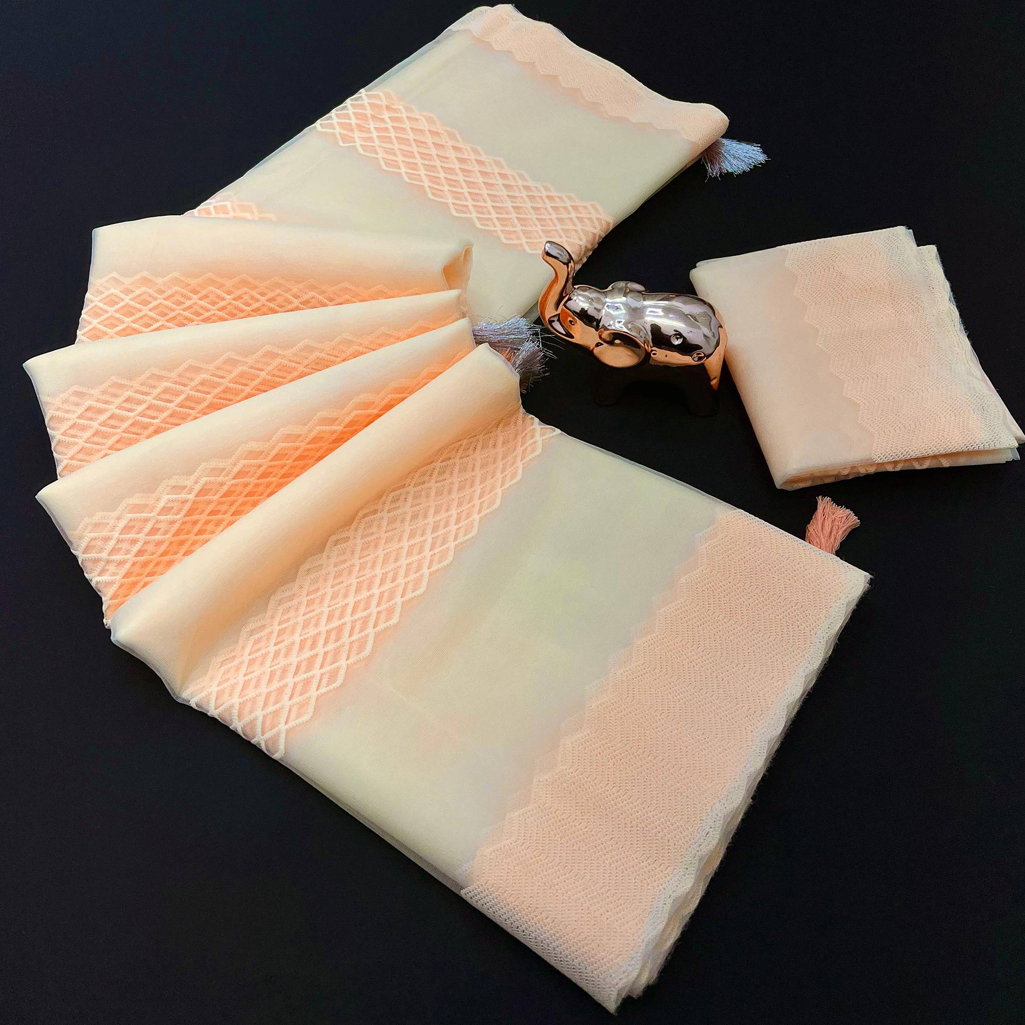 Light Peach Woven Thread Work Net Saree With Tassels