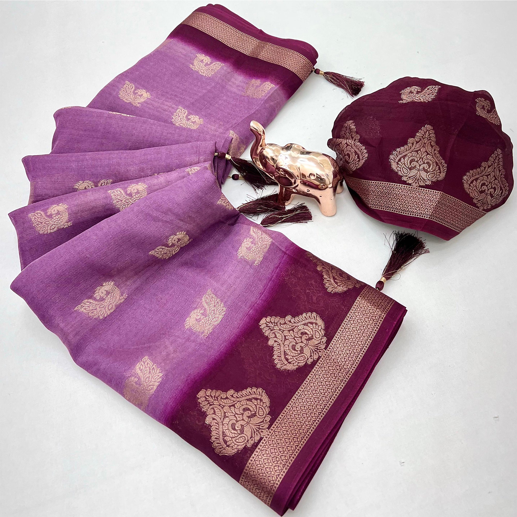 Elegant Purple Peacock Pattern Zari Weaving Georgette Saree With Tassel Pallu