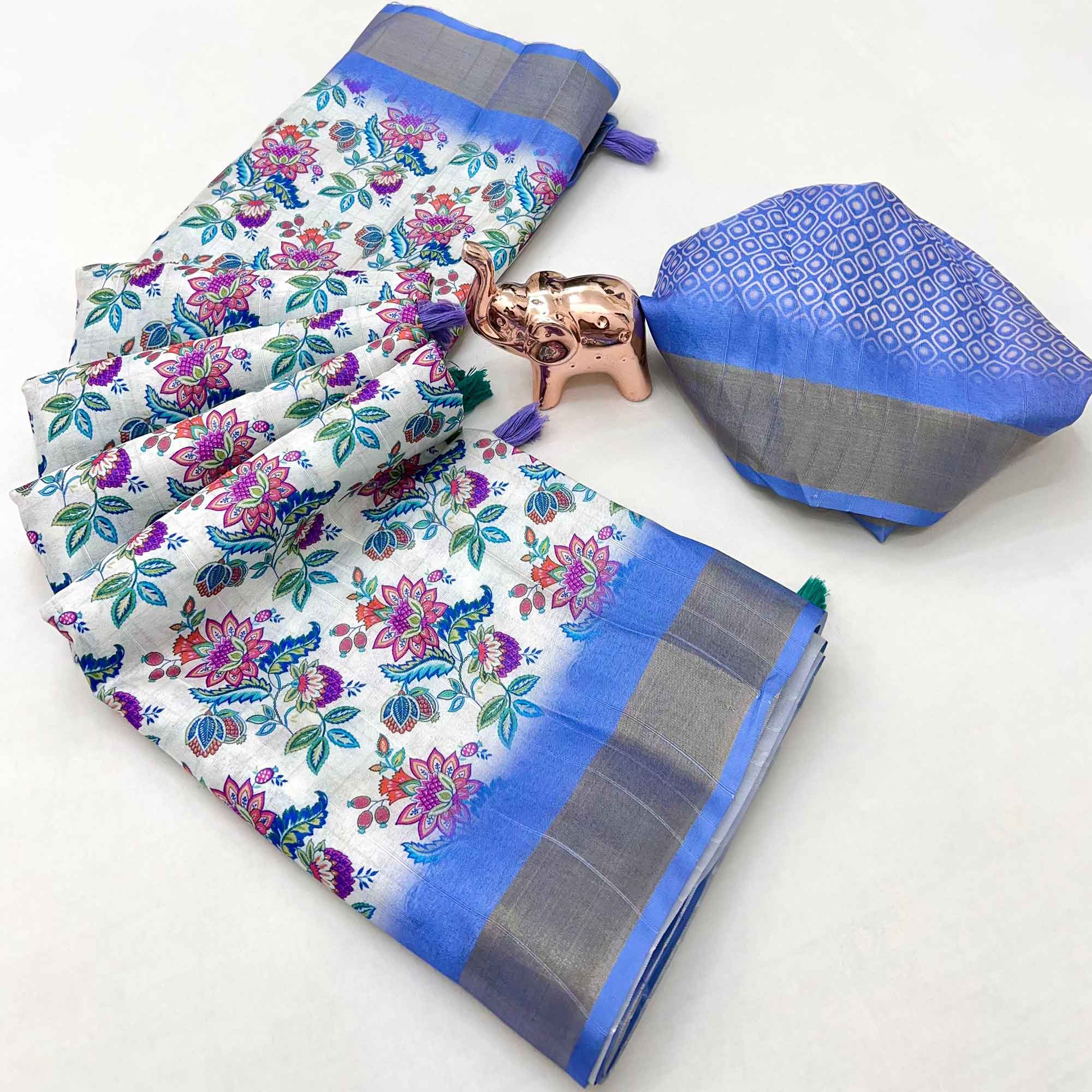 Festive White & Blue Silk Blend Saree with Subtle Floral Print and Shimmering Zari Border