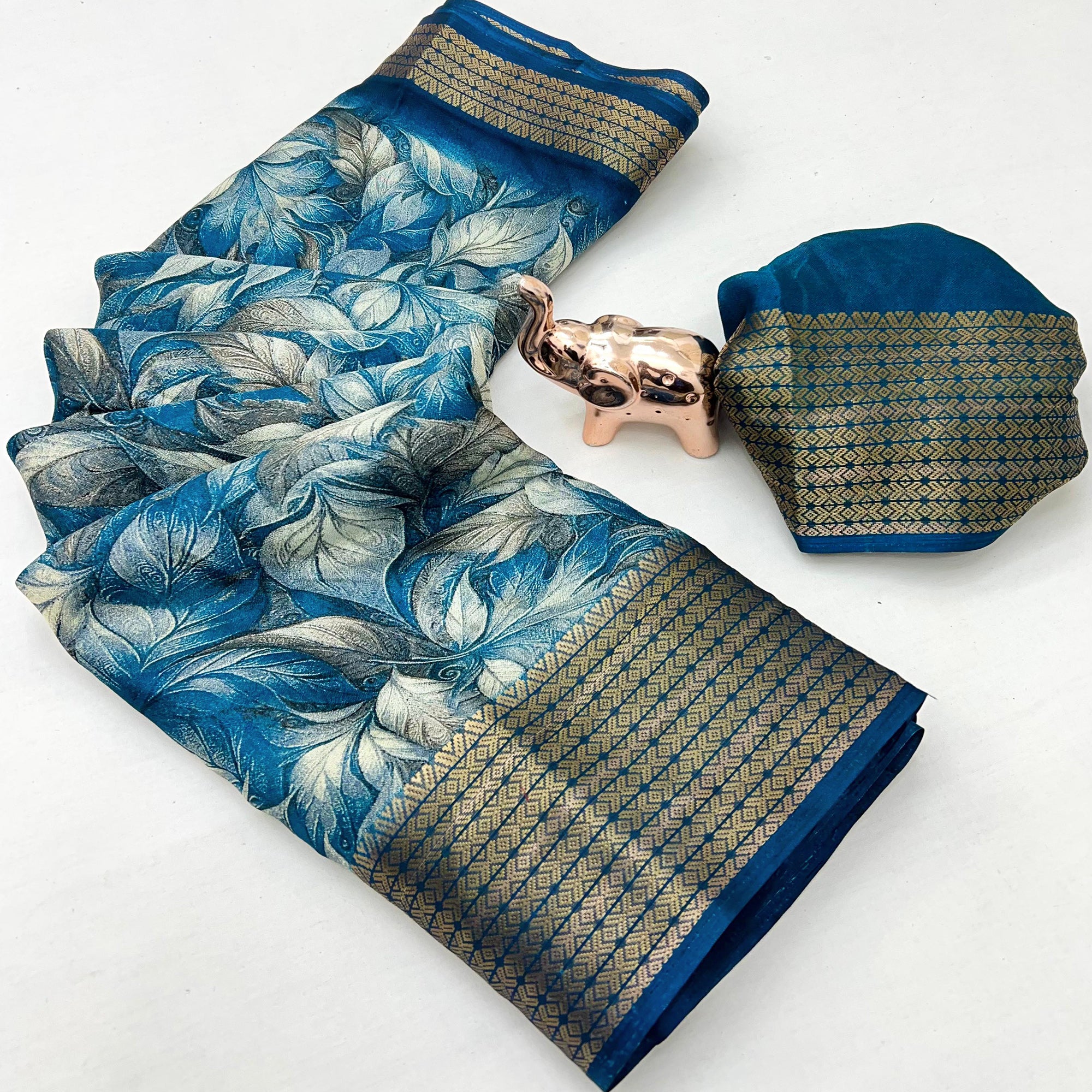 Blue Leaf Printed Dola Silk Marshmallow Saree With Paisley Jaal Pallu & Lustrous Weaving Border