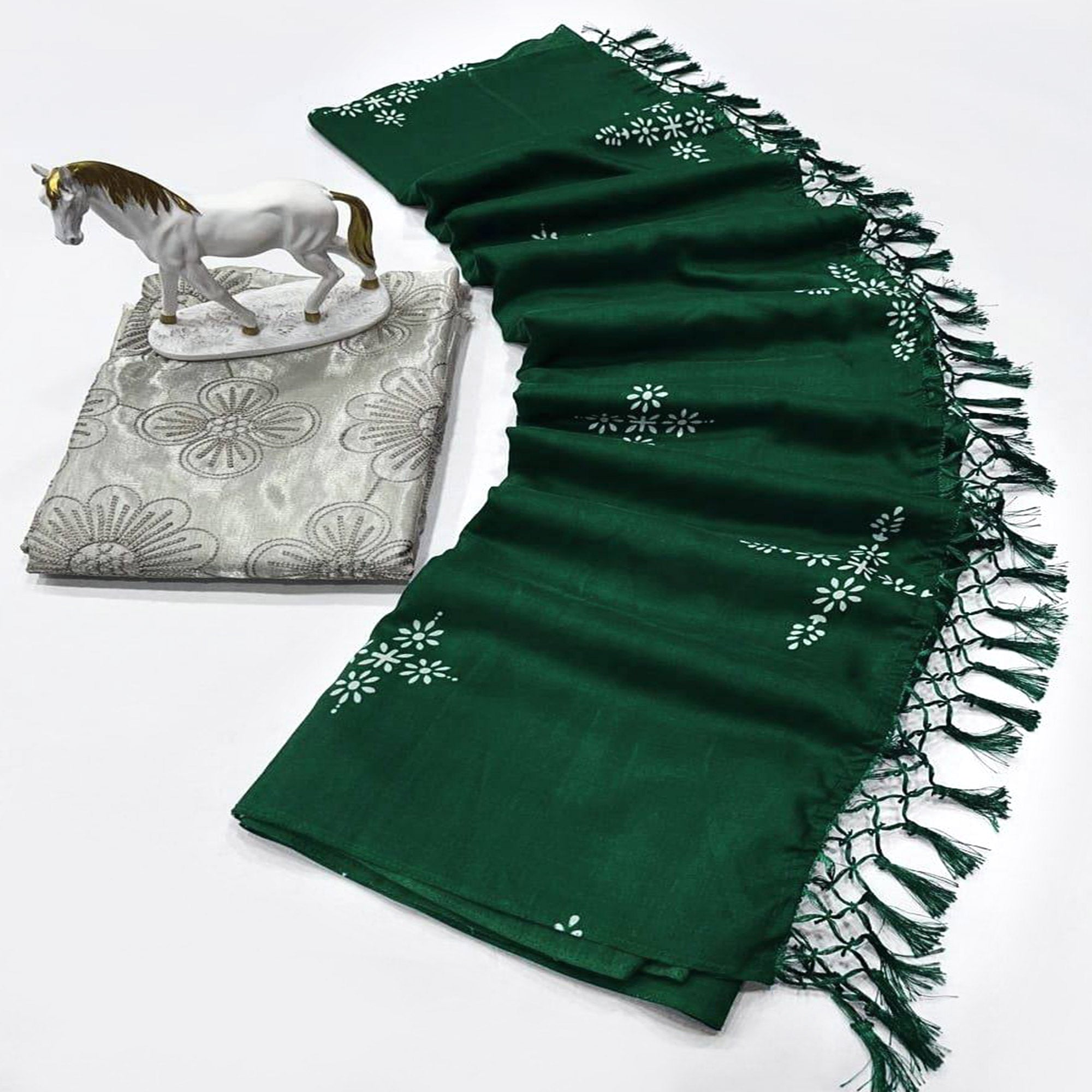 Green Muslin Cotton Silk Saree Adorned With Delicate Floral Prints & Playful Tassels