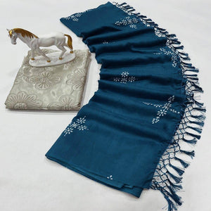 Peacock Blue Muslin Cotton Silk Saree Adorned With Delicate Floral Prints & Playful Tassels